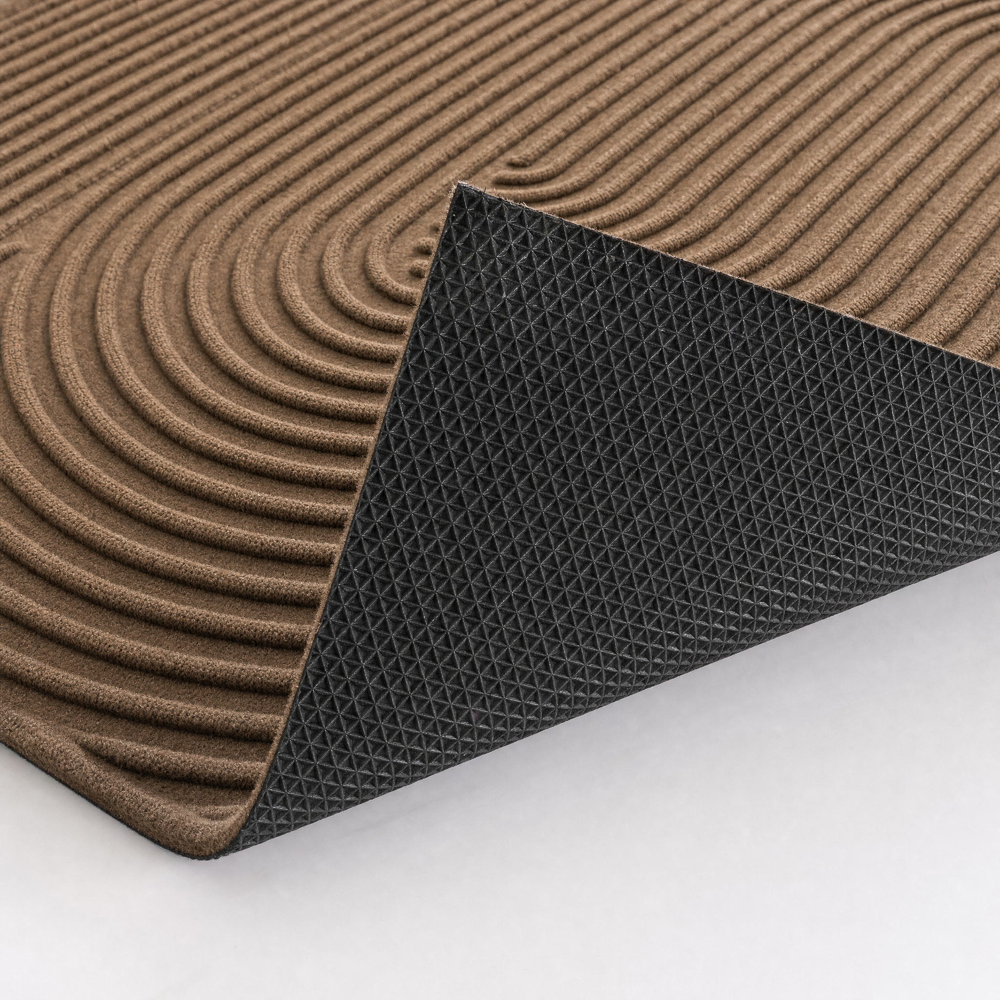 Underside reveal showing the black pyramid rubber/vinyl anti-slip backing