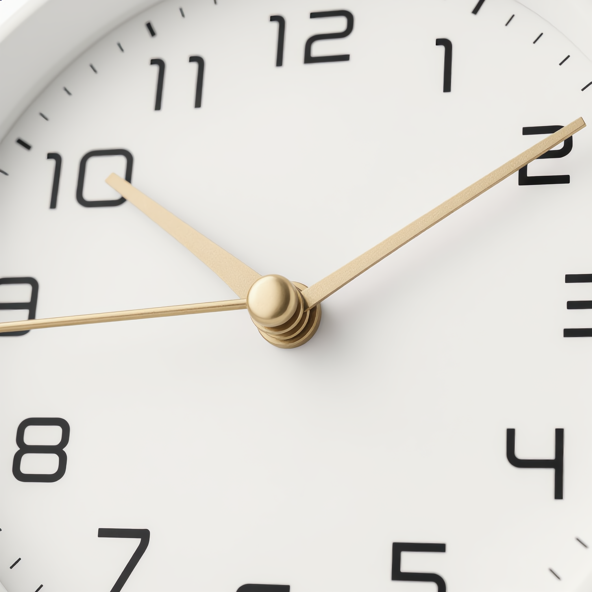 Close-up of the Serena clock white dial and gold hands