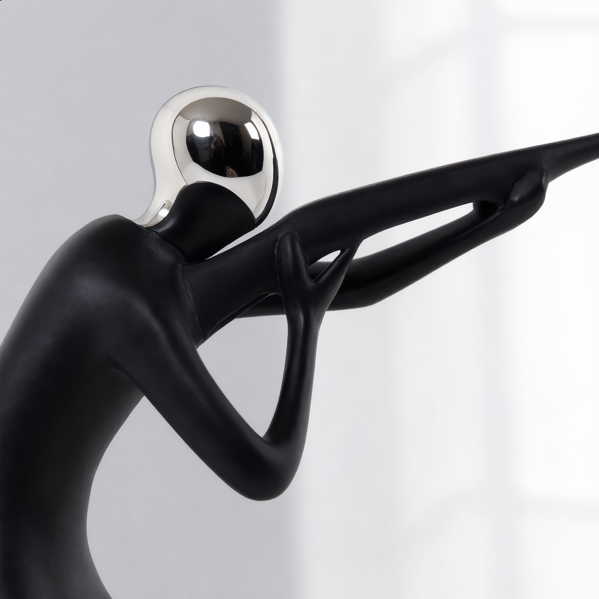 Detail of the chrome head and matte black body in bright daylight