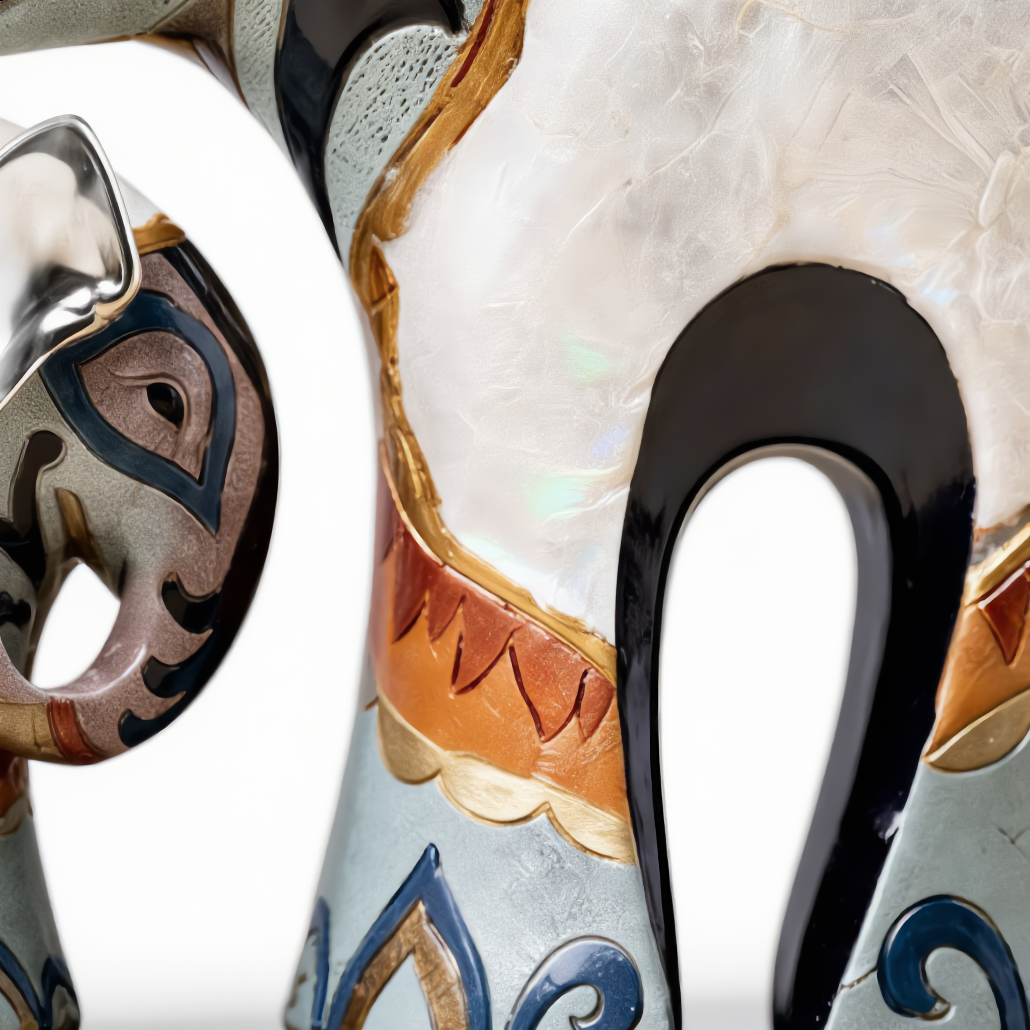 Close-up of the iridescent mother-of-pearl body and painted pattern