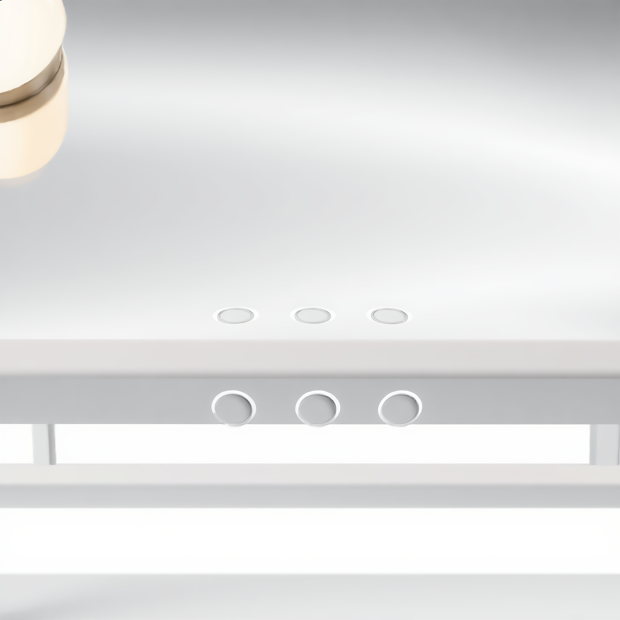 Close-up of the three touch-sensor control buttons on the vanity mirror