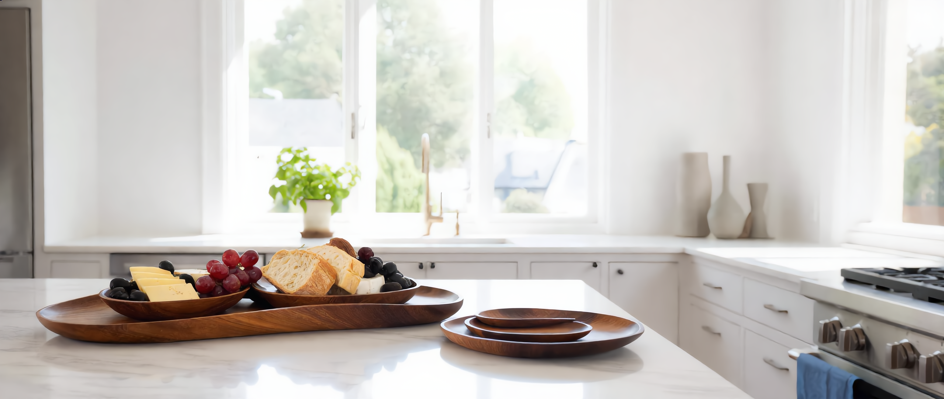 Toscana acacia serving trays styled in a bright Mediterranean kitchen