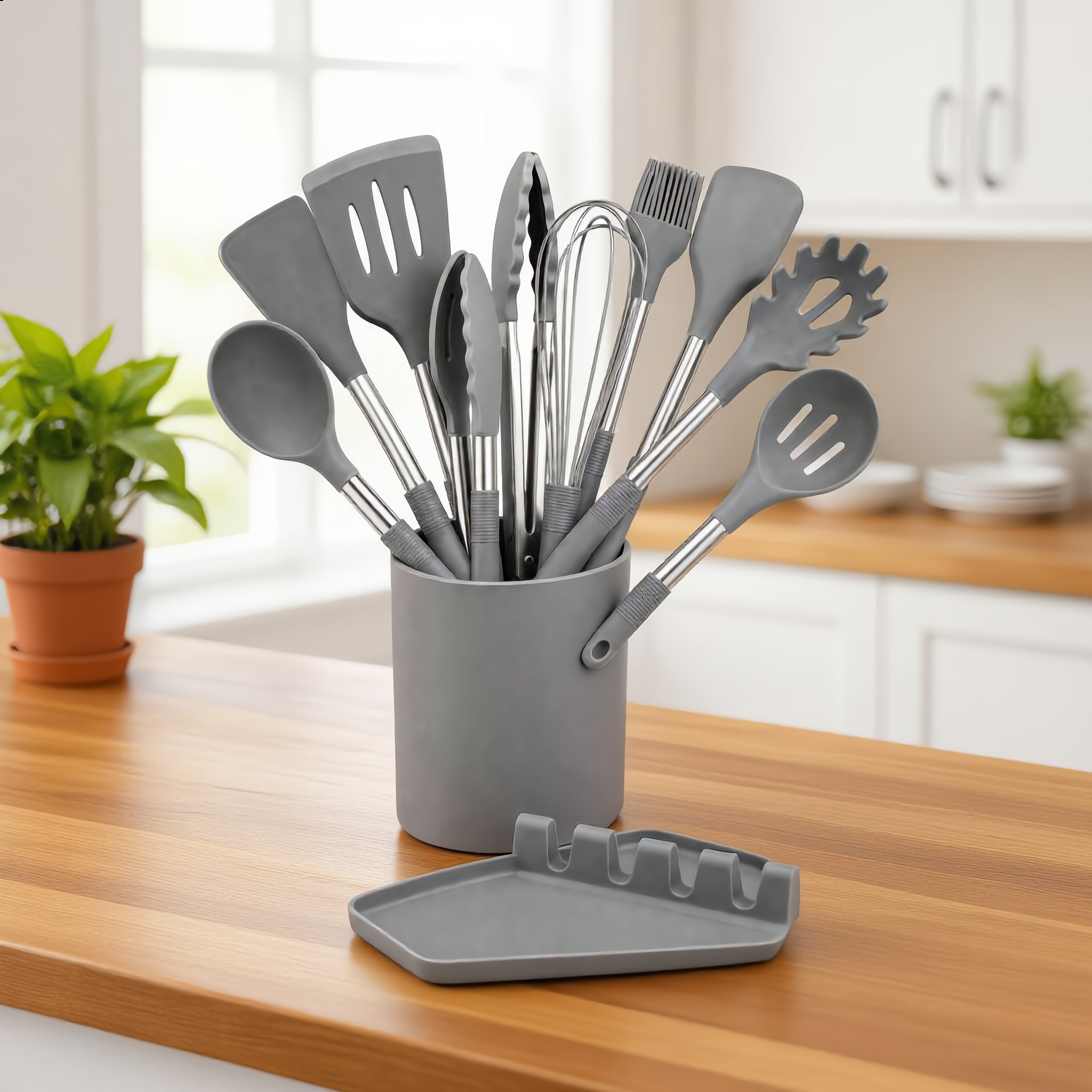 Gray Nordica set in its caddy on a warm wood counter with a plant