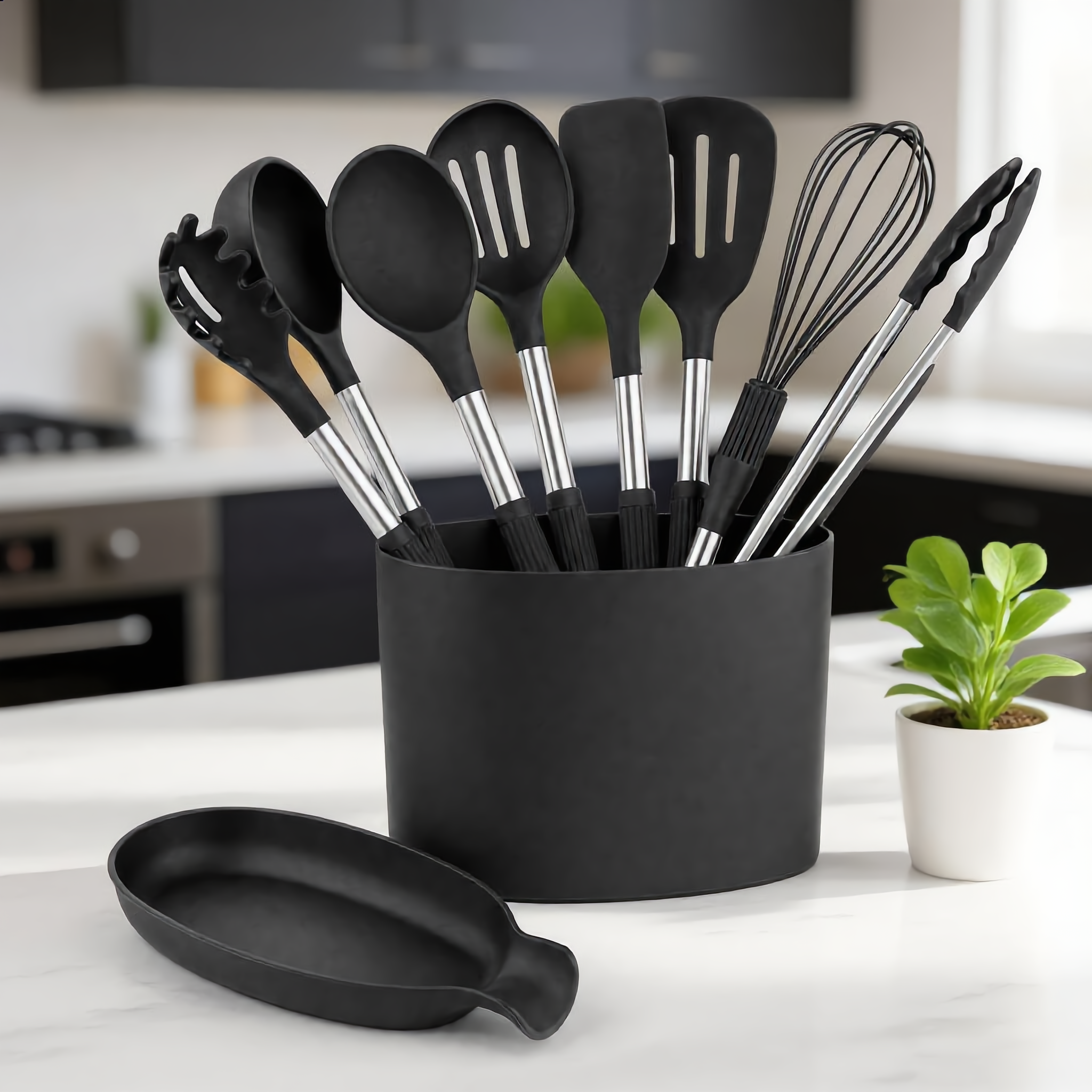 Black Nordica set in its caddy on a white marble counter in a modern kitchen