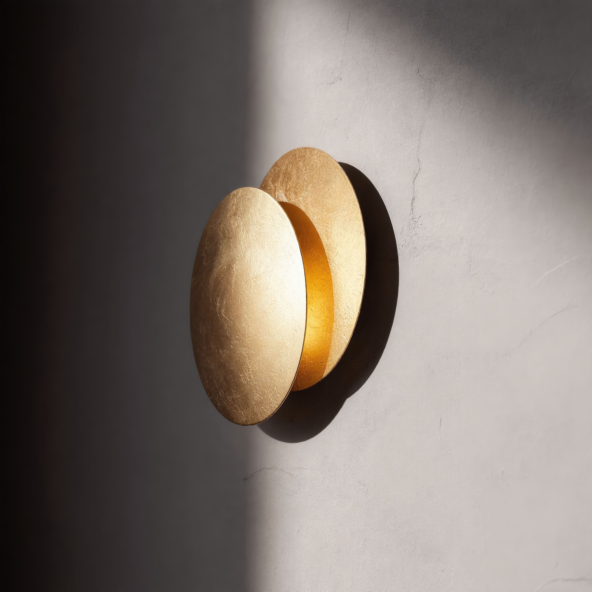 Eclissi wall sconce with cool white 6000K glow on a bright wall