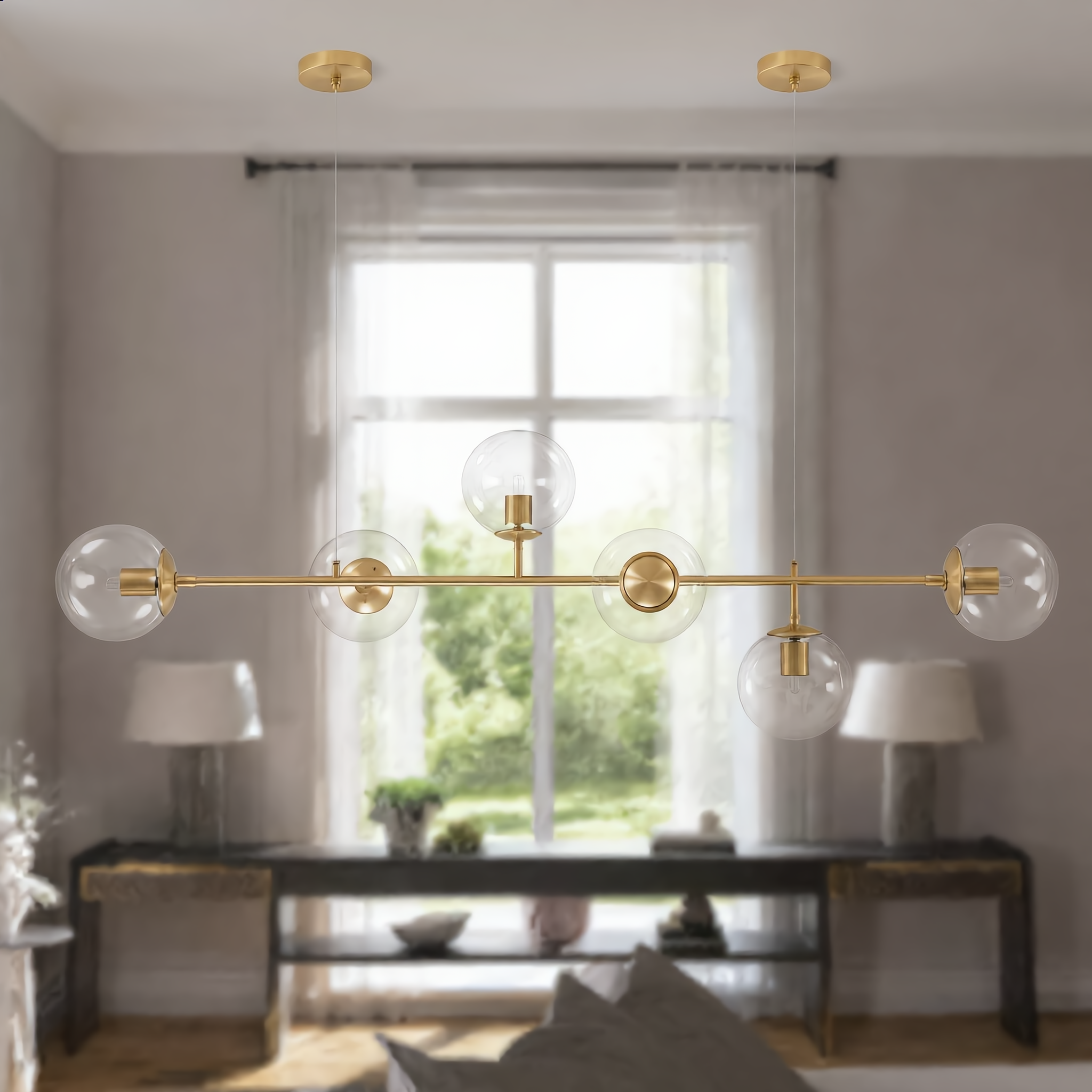 Costellazione gold horizontal pendant in a bright living room
