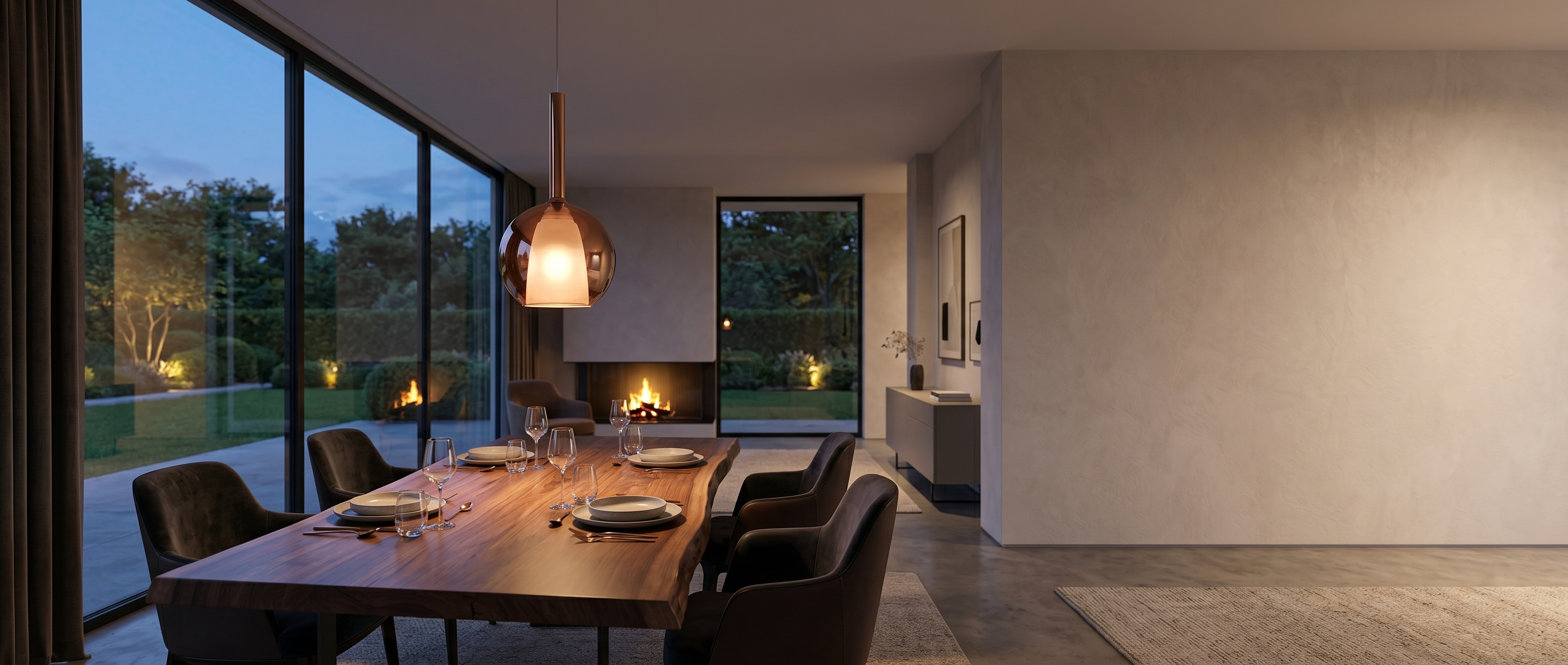 Luna Glass Globe Pendant over a dining table at dusk - banner