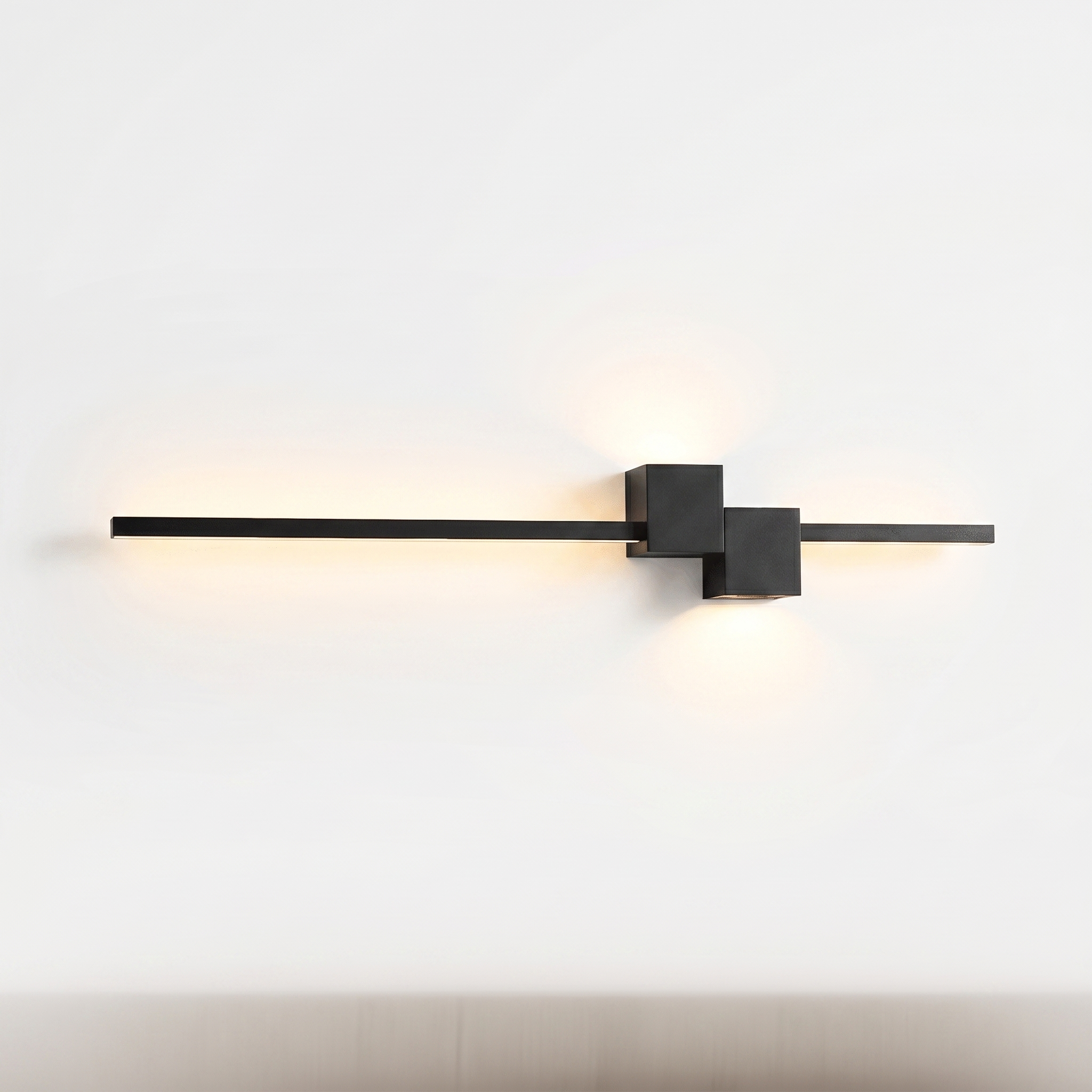 Filo linear LED wall light in black, glowing, on white background