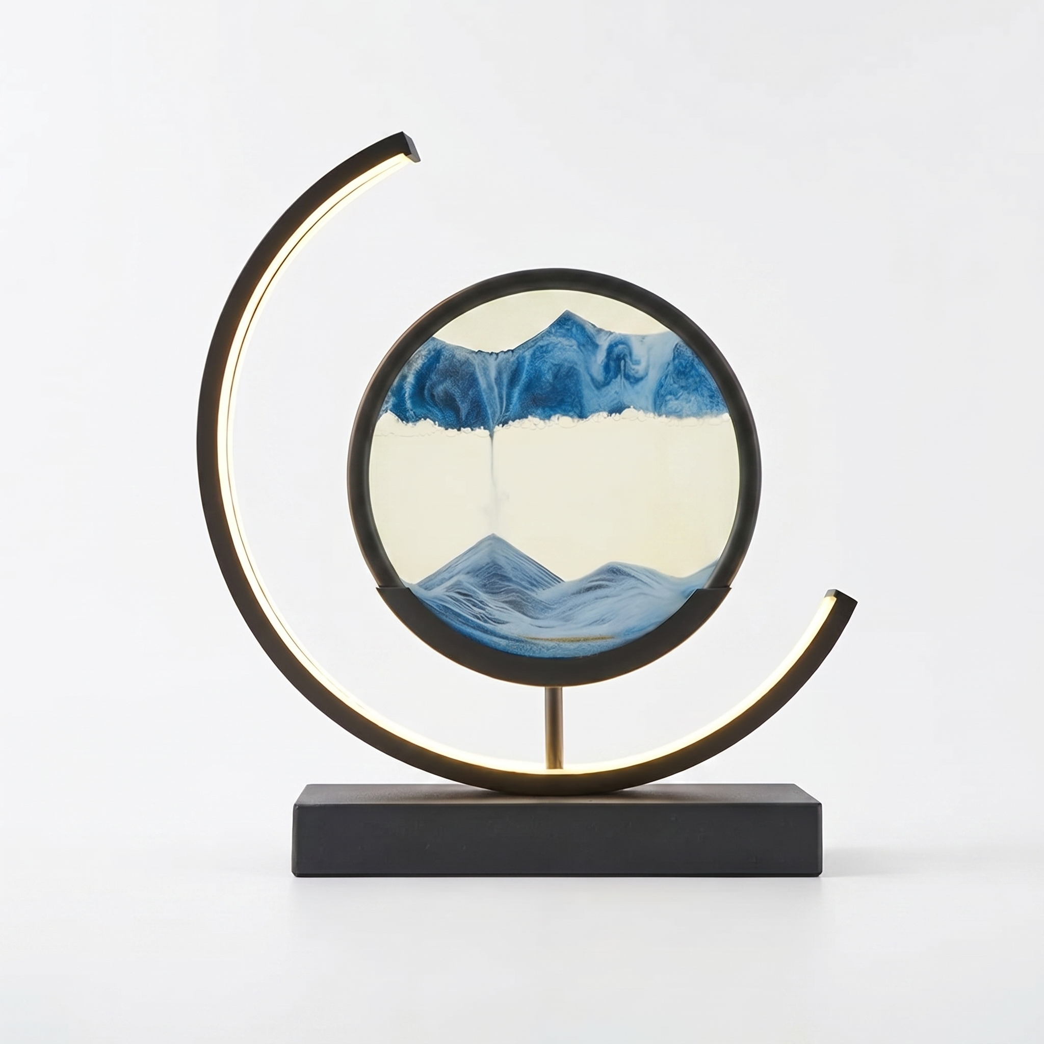 Duna moving sand art lamp with blue sandscape, glowing, on white