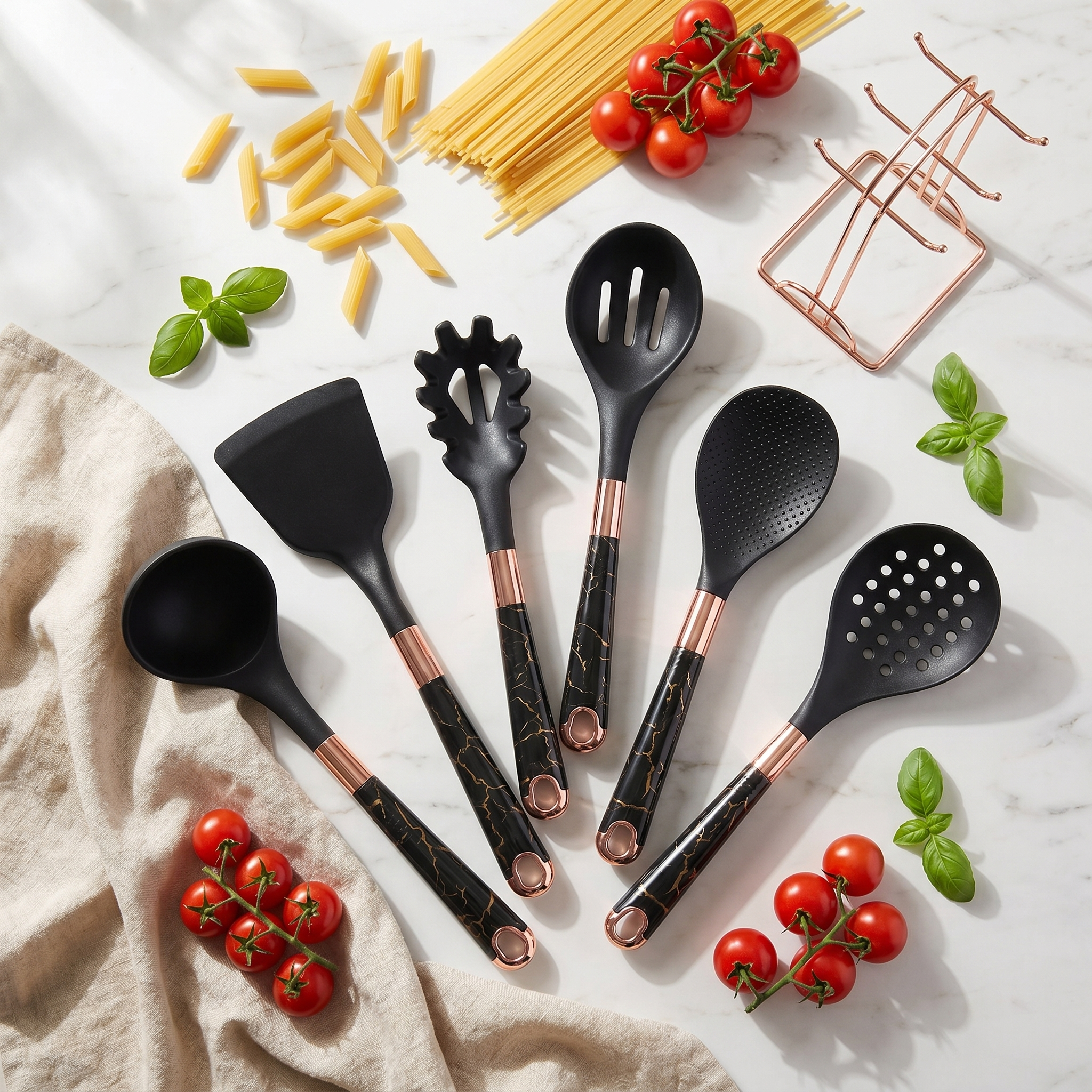 Black Marmo utensil set flat lay on marble with pasta and basil