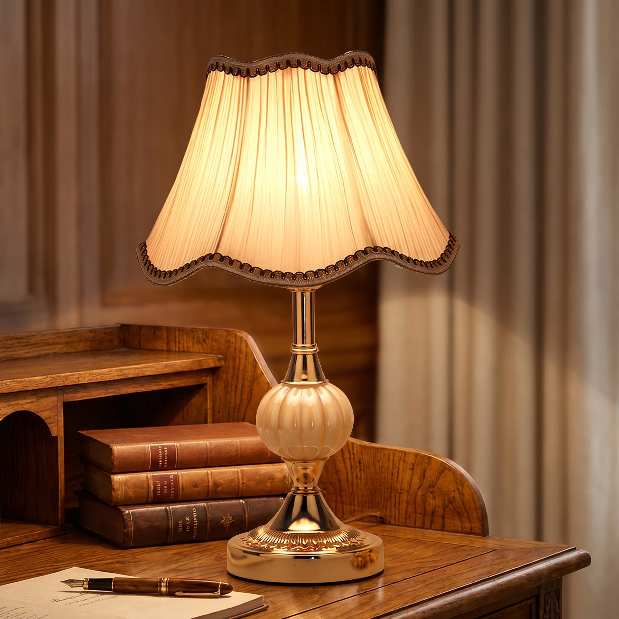 Cream pleated table lamp on a writing desk in a refined study