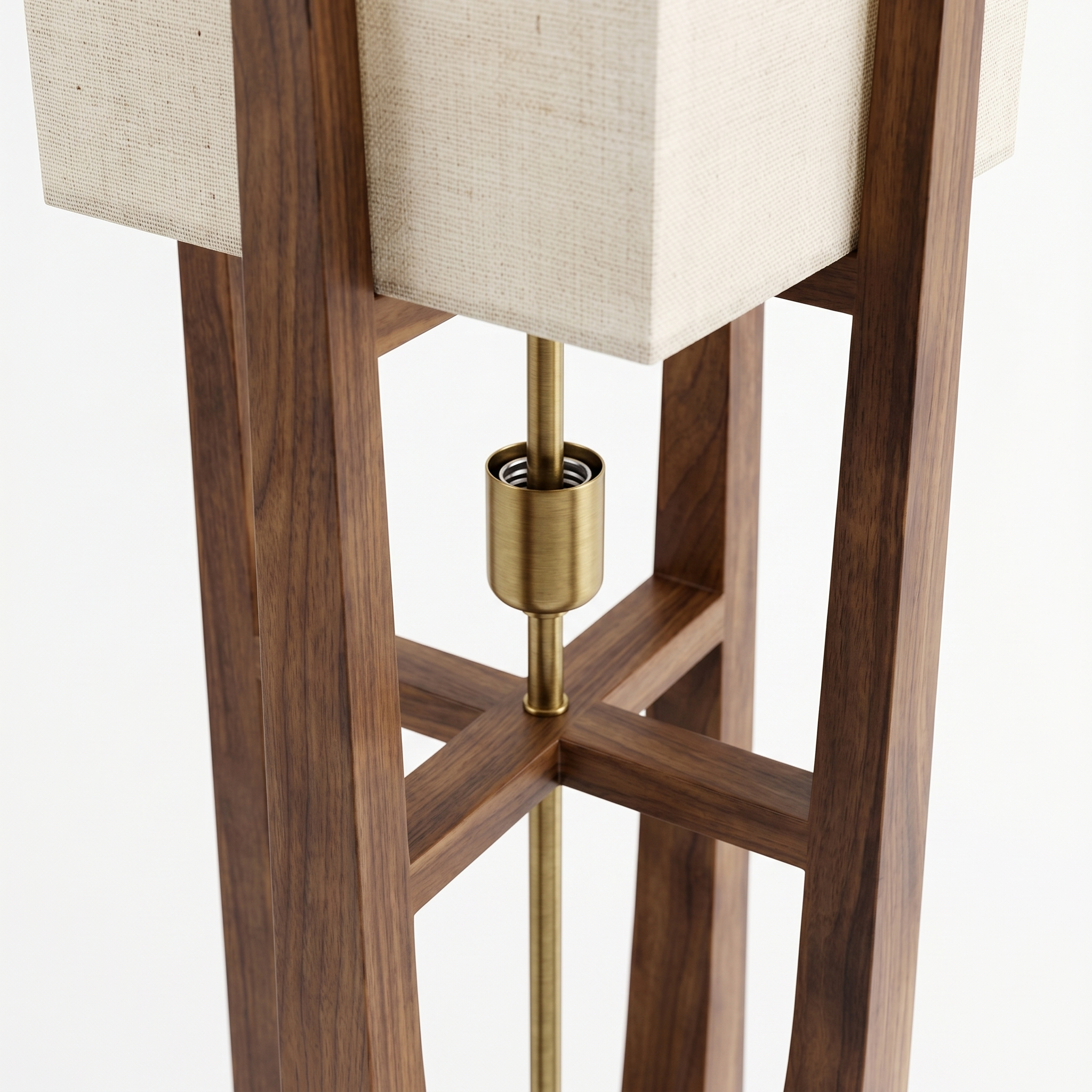 Close-up of the crossing wood legs, brass socket and linen shade