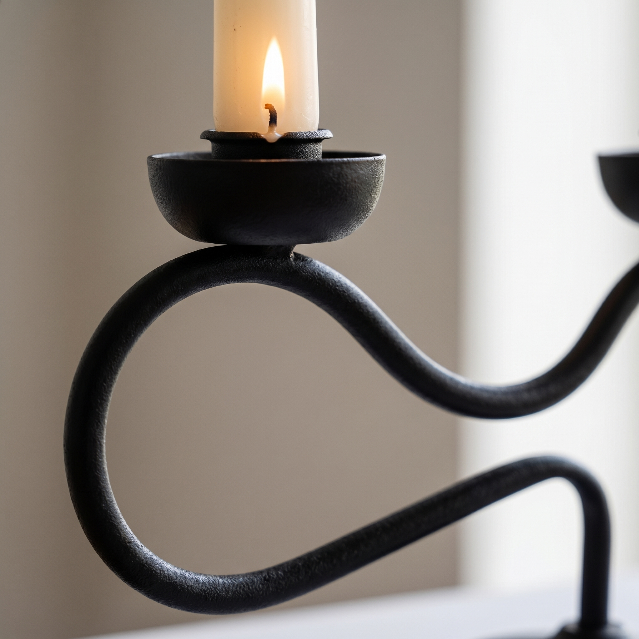 Close-up of the wavy iron and candle flame