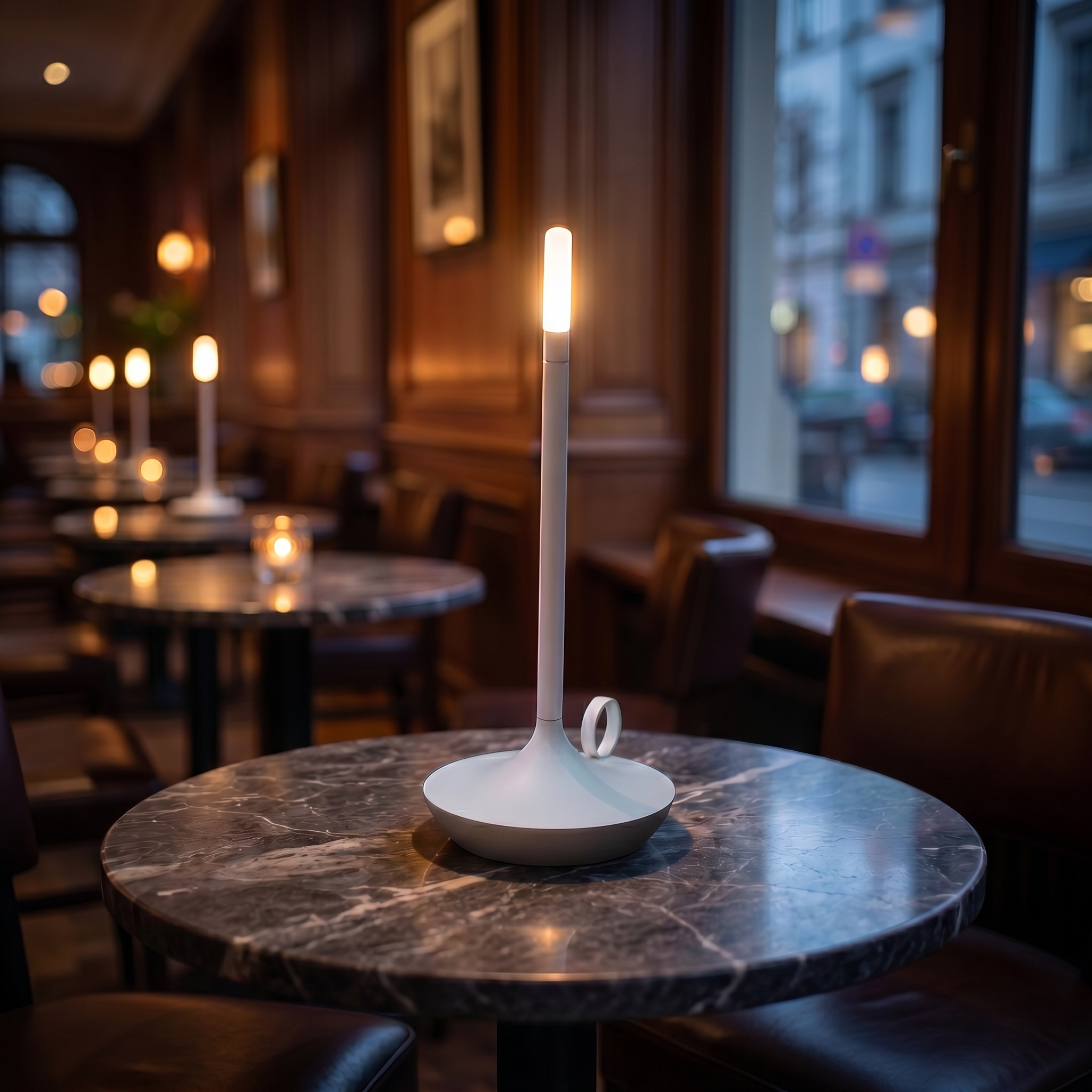 Fiamma white lamp on a cafe table