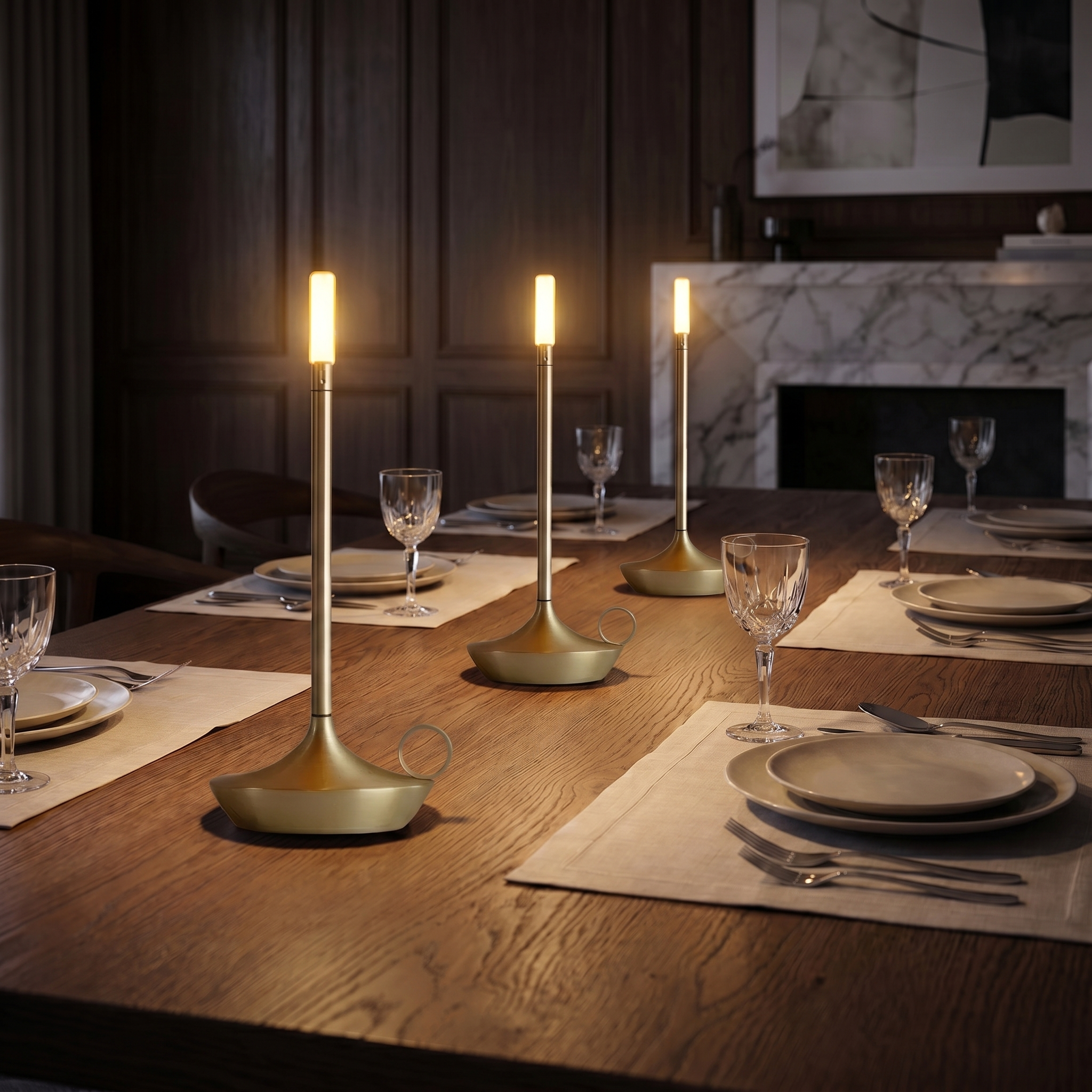 Fiamma gold lamps along a dining table