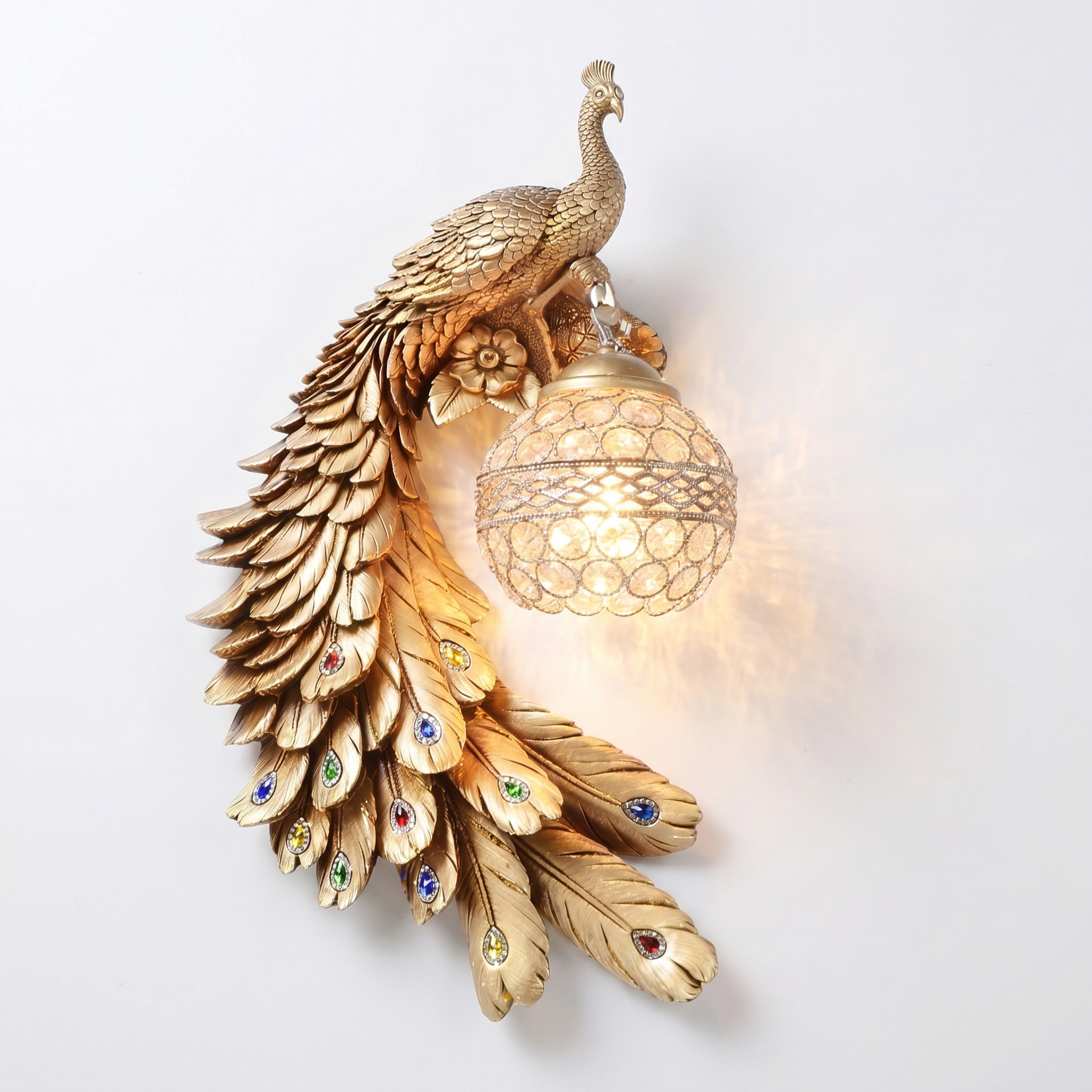 Pavone gold peacock crystal wall sconce, left facing, crystal ball lit