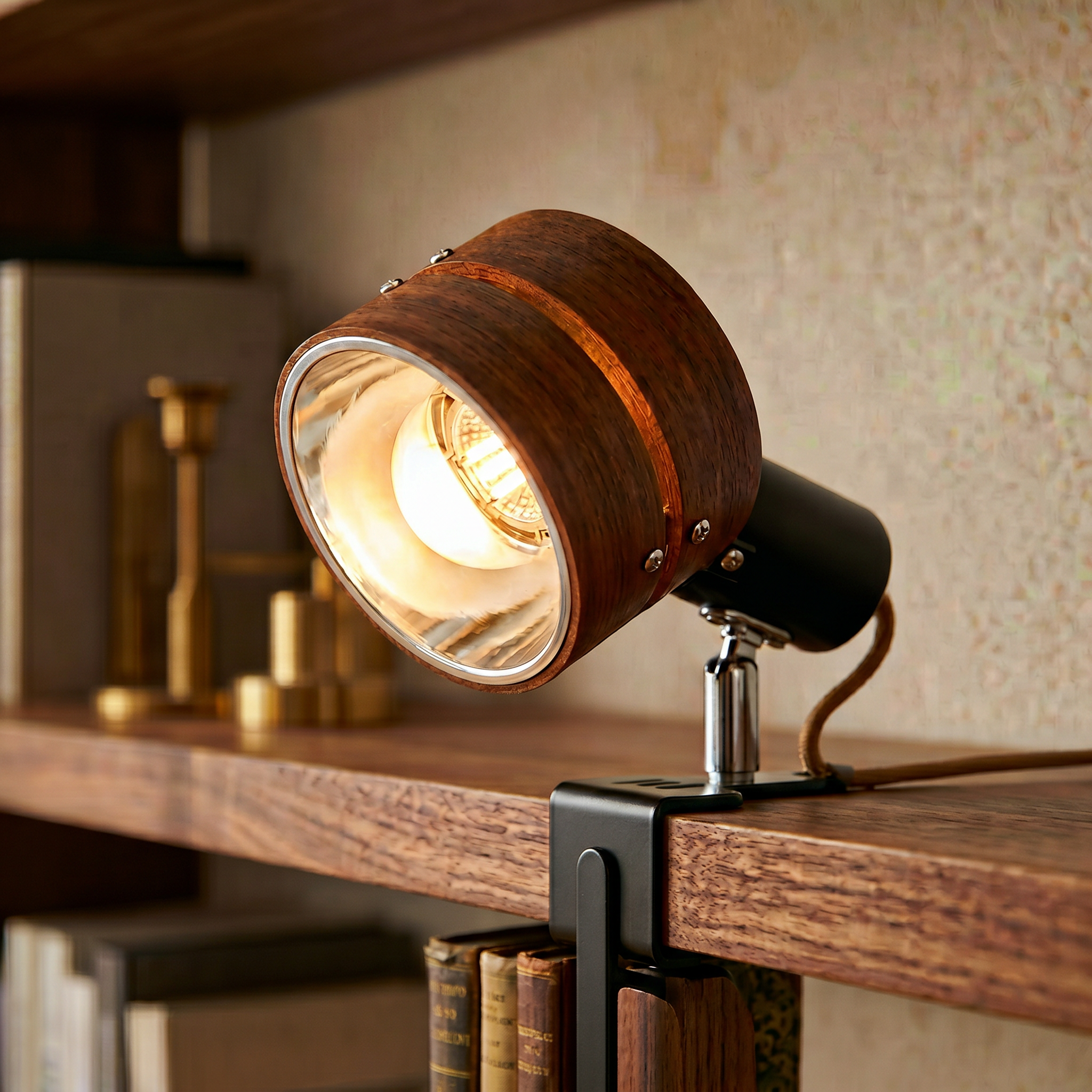 Close-up of the walnut wood clip lamp grain and warm glow