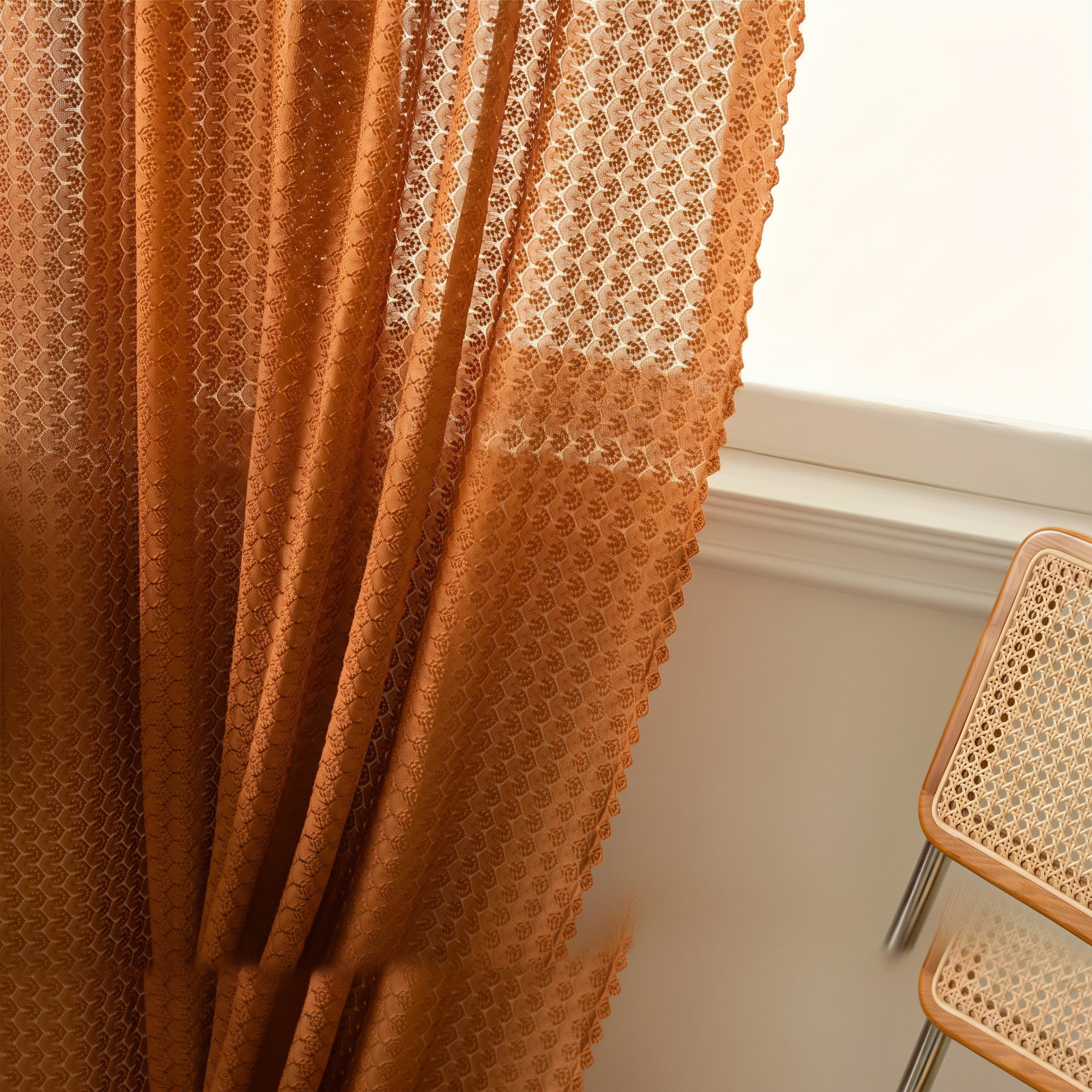Amber boho crochet curtain tied back at a bright window