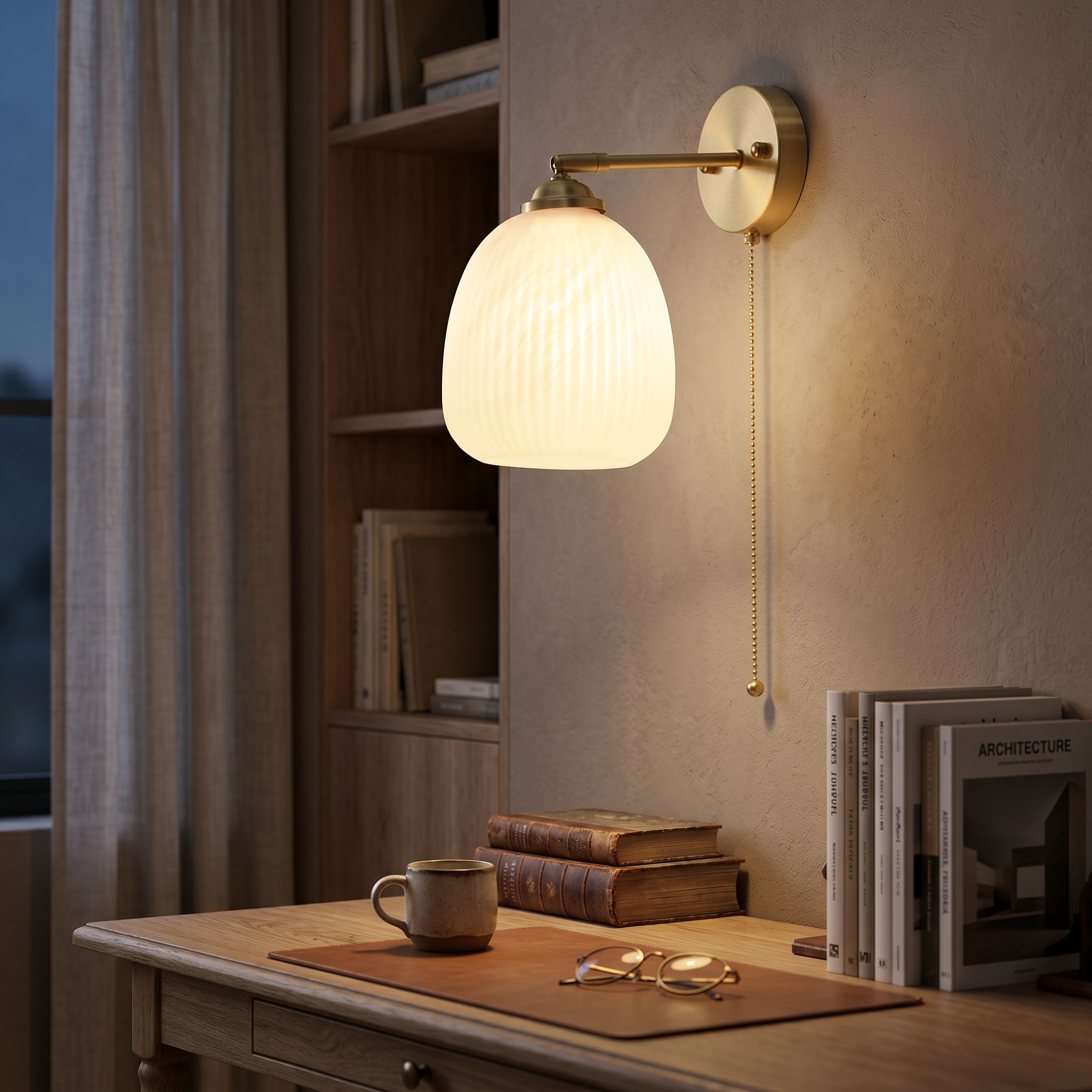 Fluted bell Giglio sconce glowing in a study