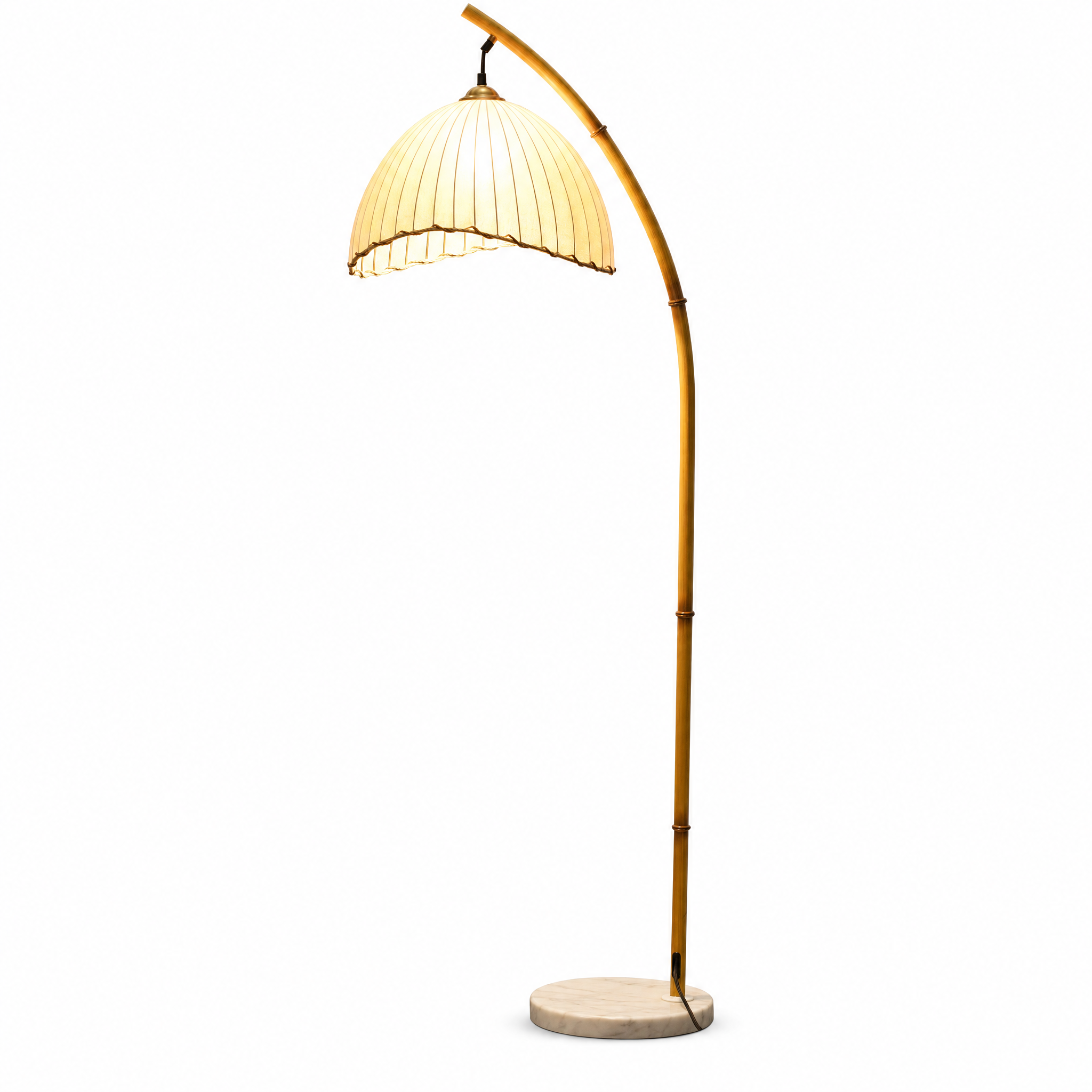 Loto bamboo arc floor lamp with a warm glow on white