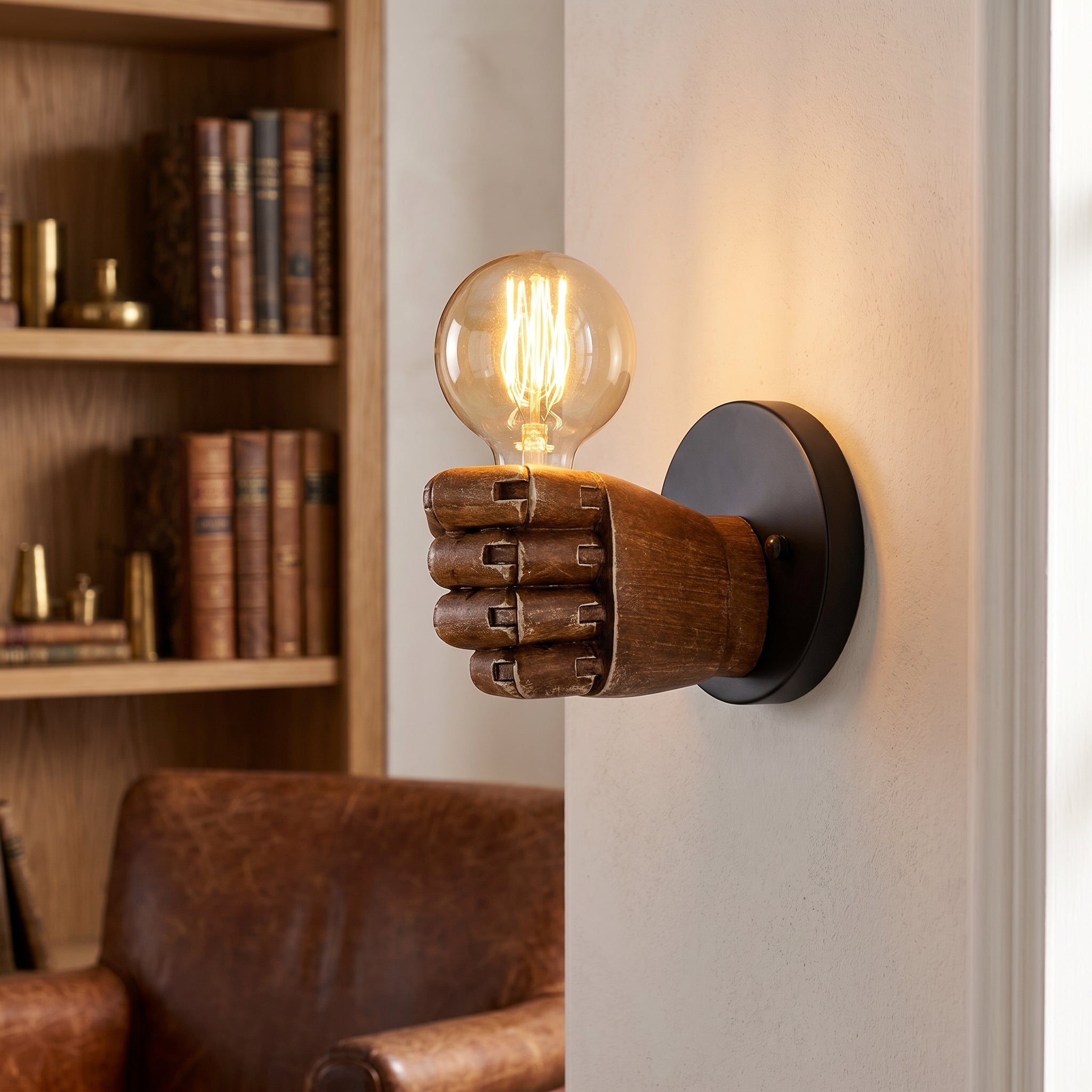 Mano fist wall sconce in a cozy reading nook