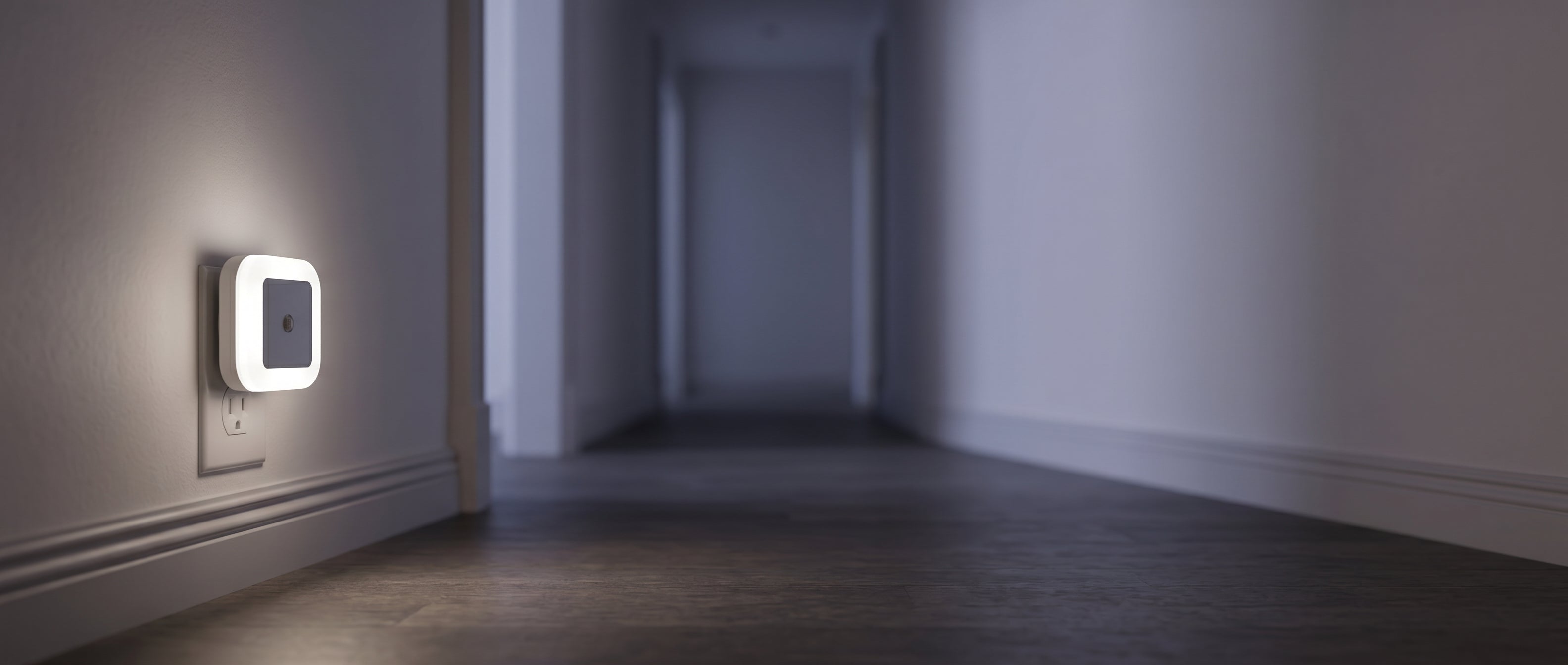 Stellina Plug-In Night Light glowing in a twilight hallway banner