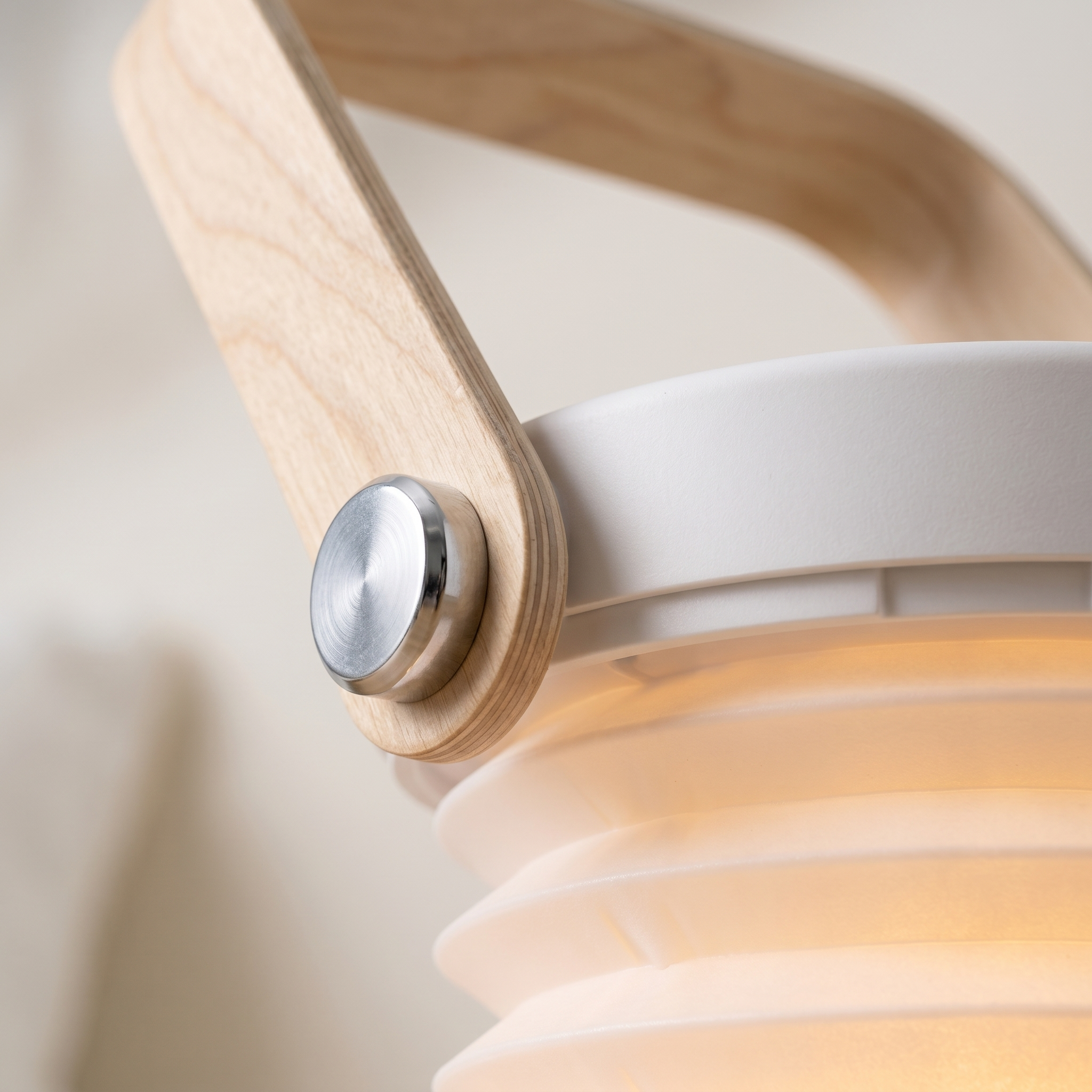 Close-up of the birch handle joint and frosted accordion shade