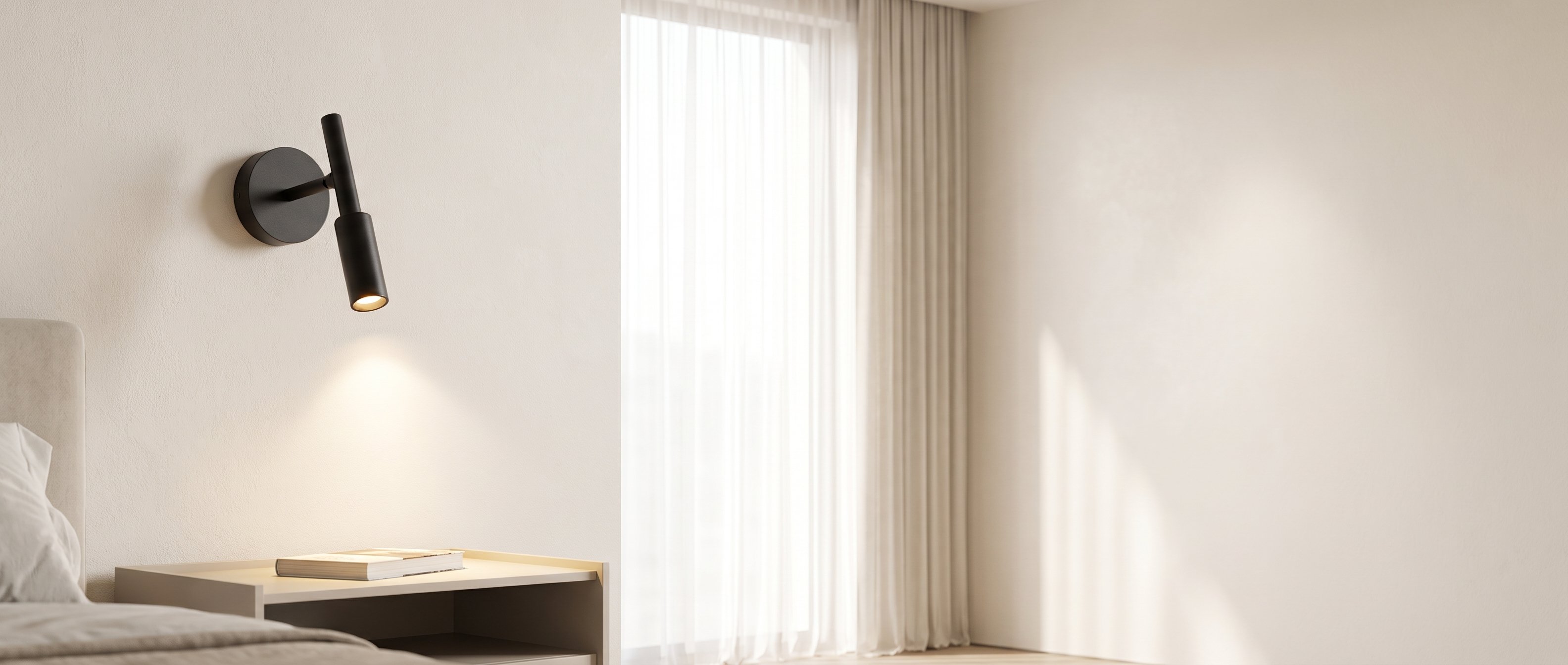 Veglia Soffusa black reading light glowing beside a bed in a bright bedroom