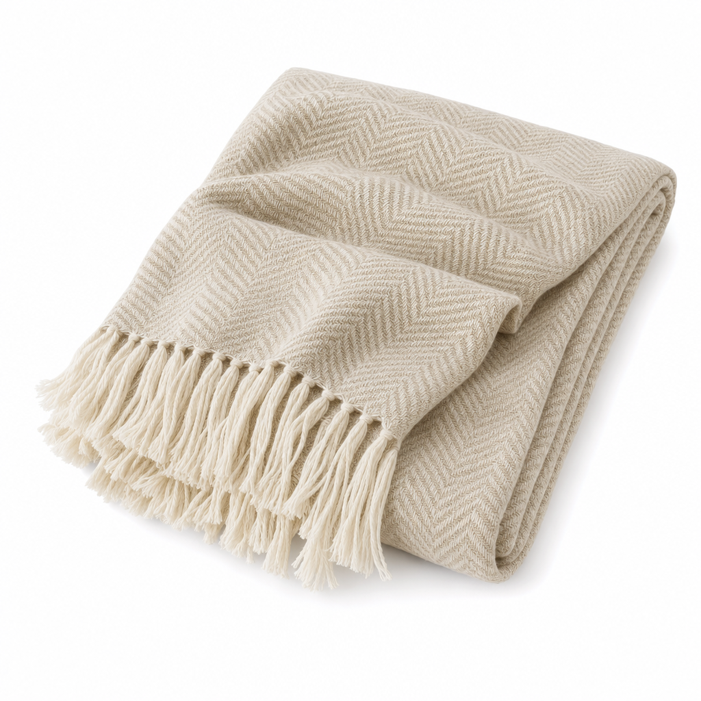 Brezza Marina woven throw blanket in natural beige, folded on white