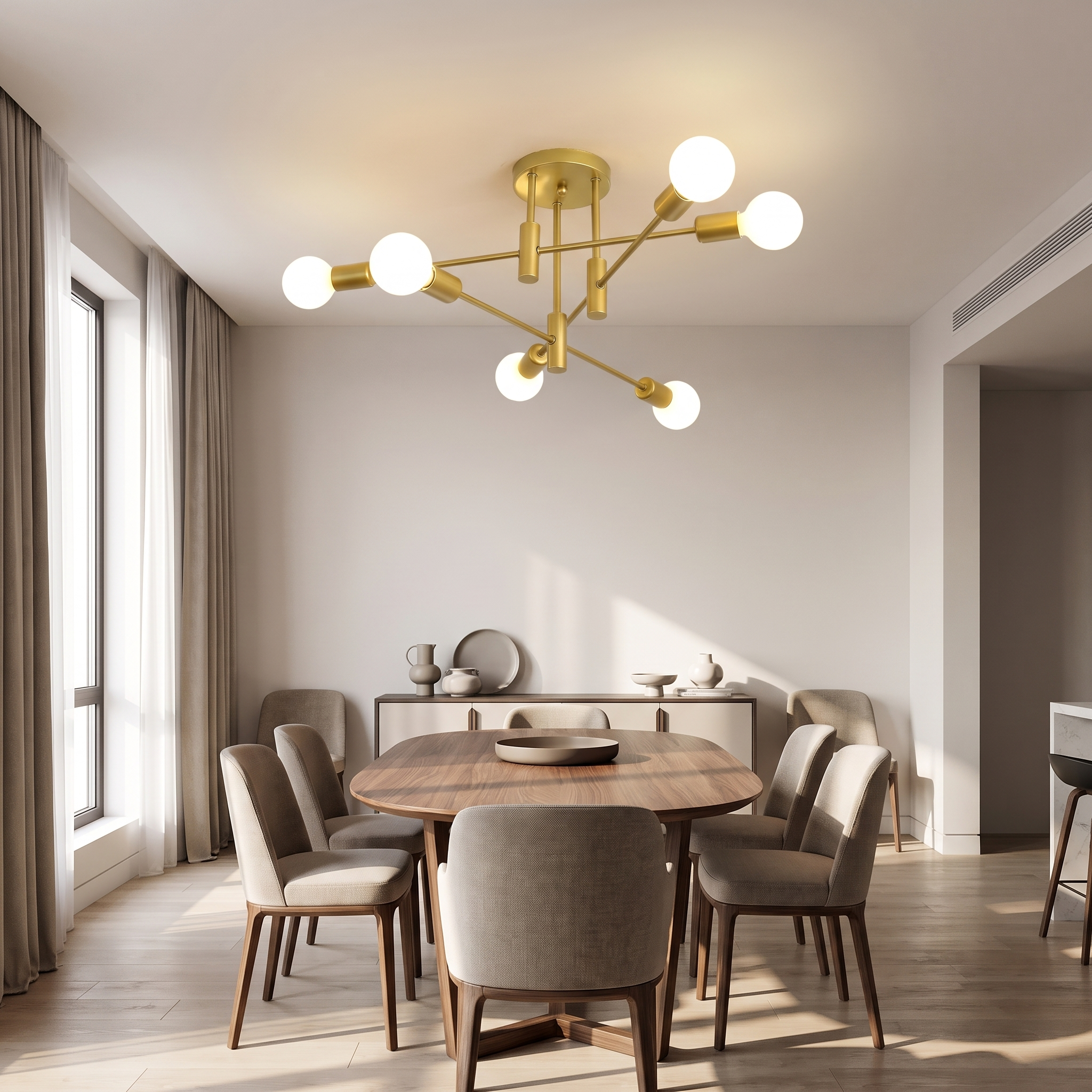 All gold sputnik ceiling light above a walnut dining table