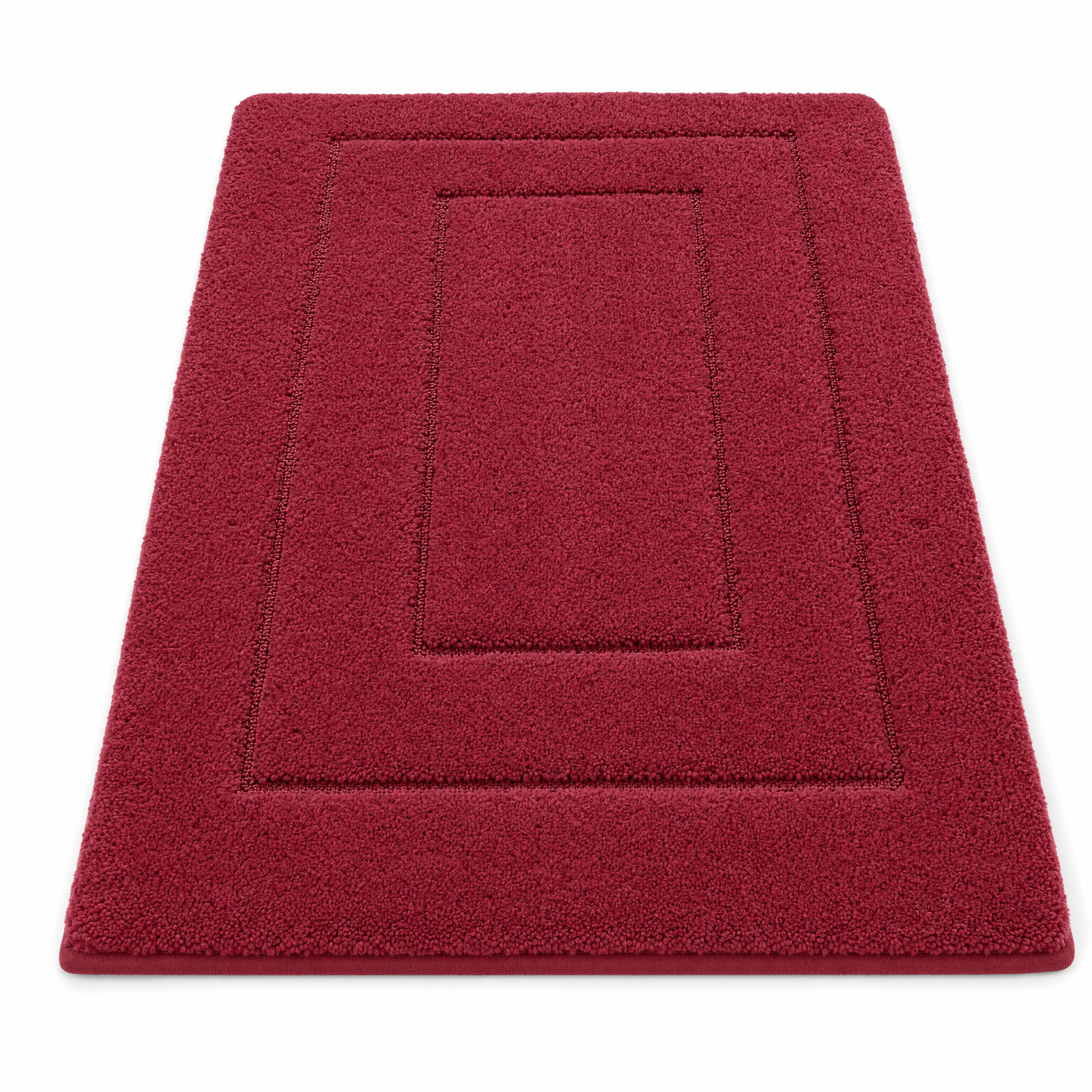 Crimson red plush bath mat on a white background