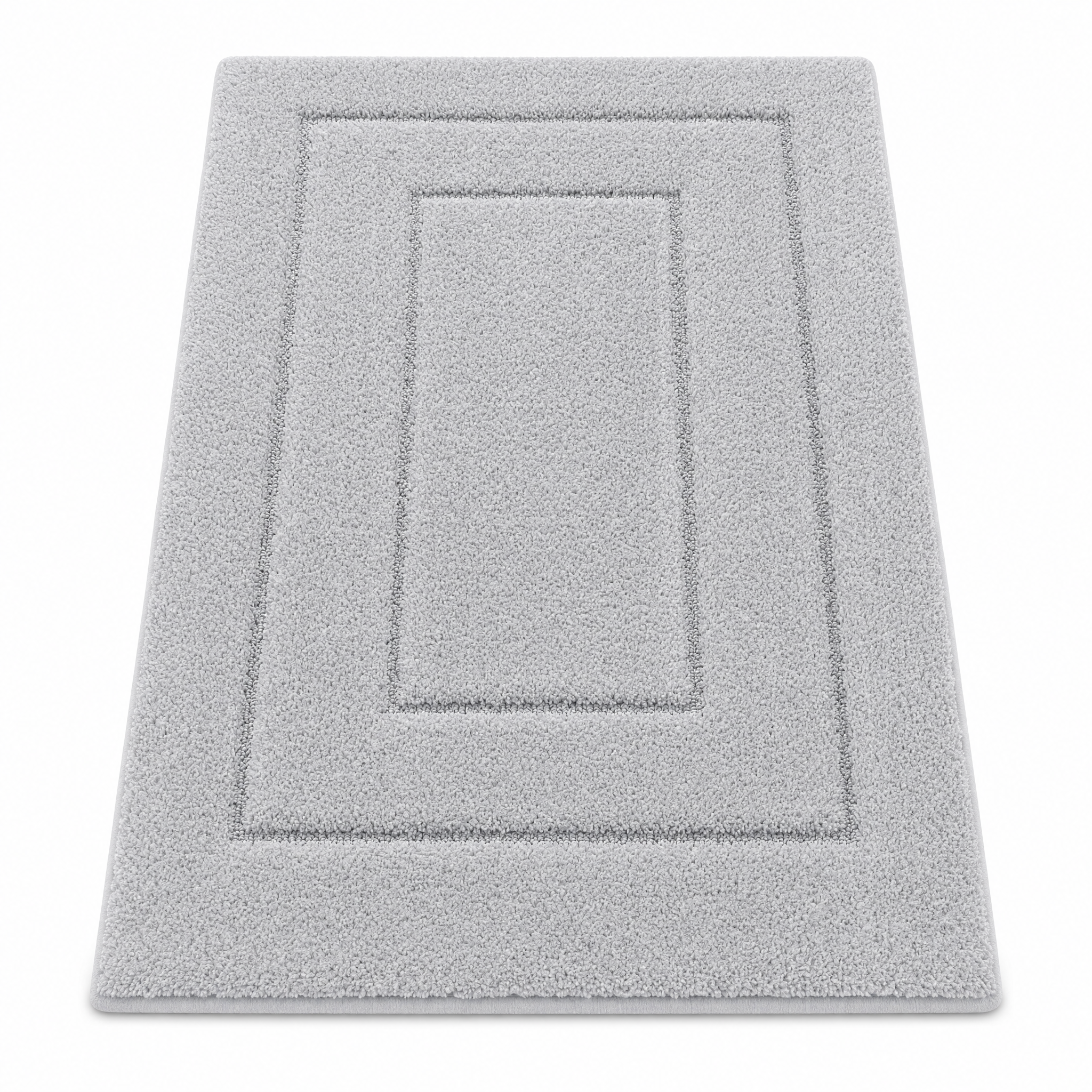 Light gray plush bath mat on a white background