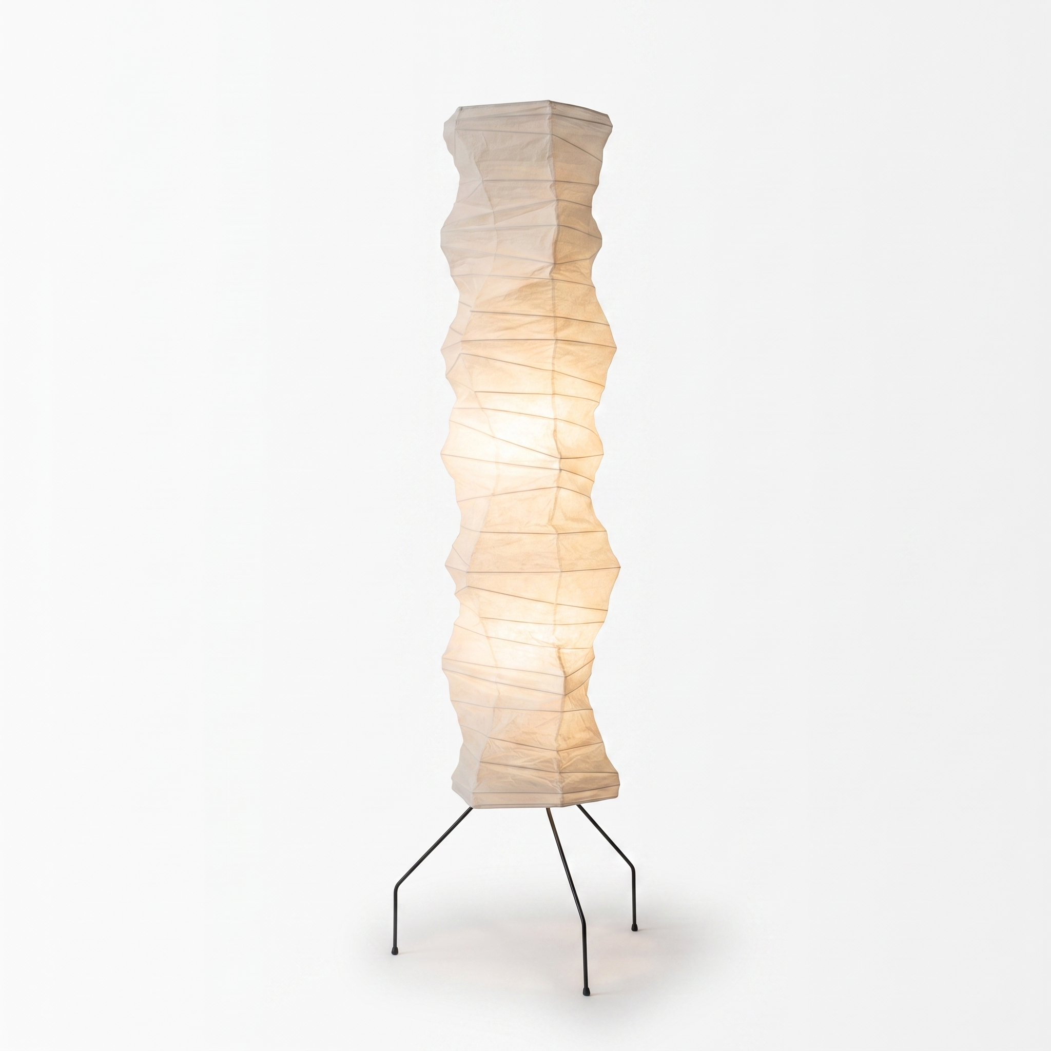Luna Velata rice paper floor lamp glowing warm white on a black tripod