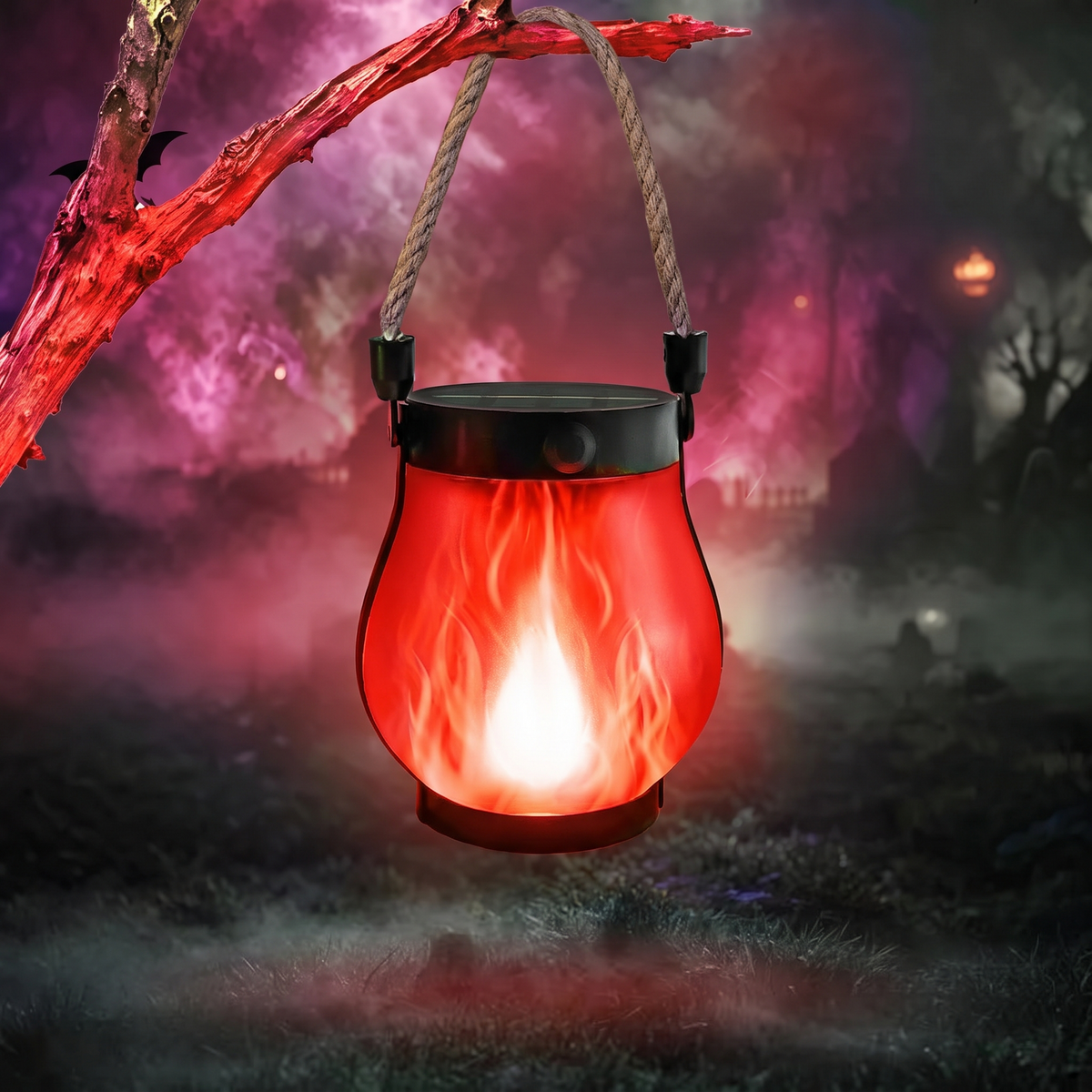 Red flame solar lantern hanging from a branch in misty night
