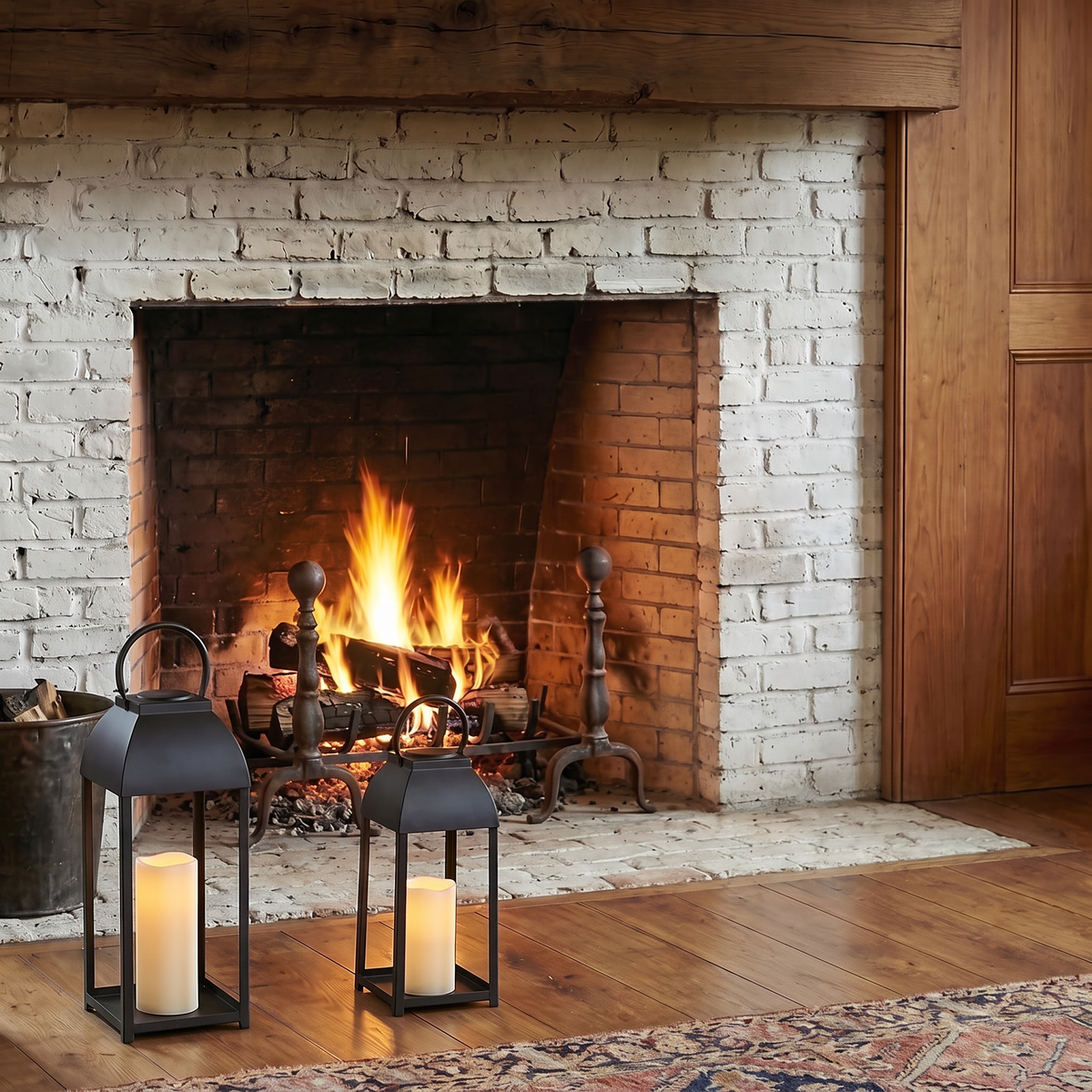Black candle lanterns on a brick fireplace hearth