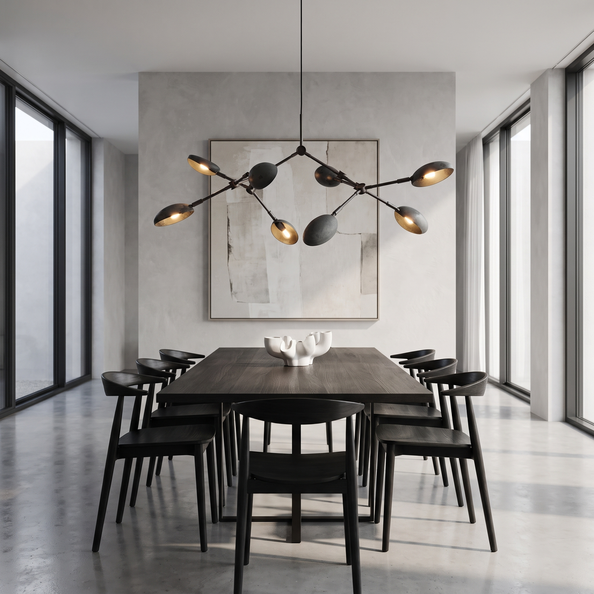 Ramo Goccia oxidized branch chandelier above a dark oak table in a modern dining room