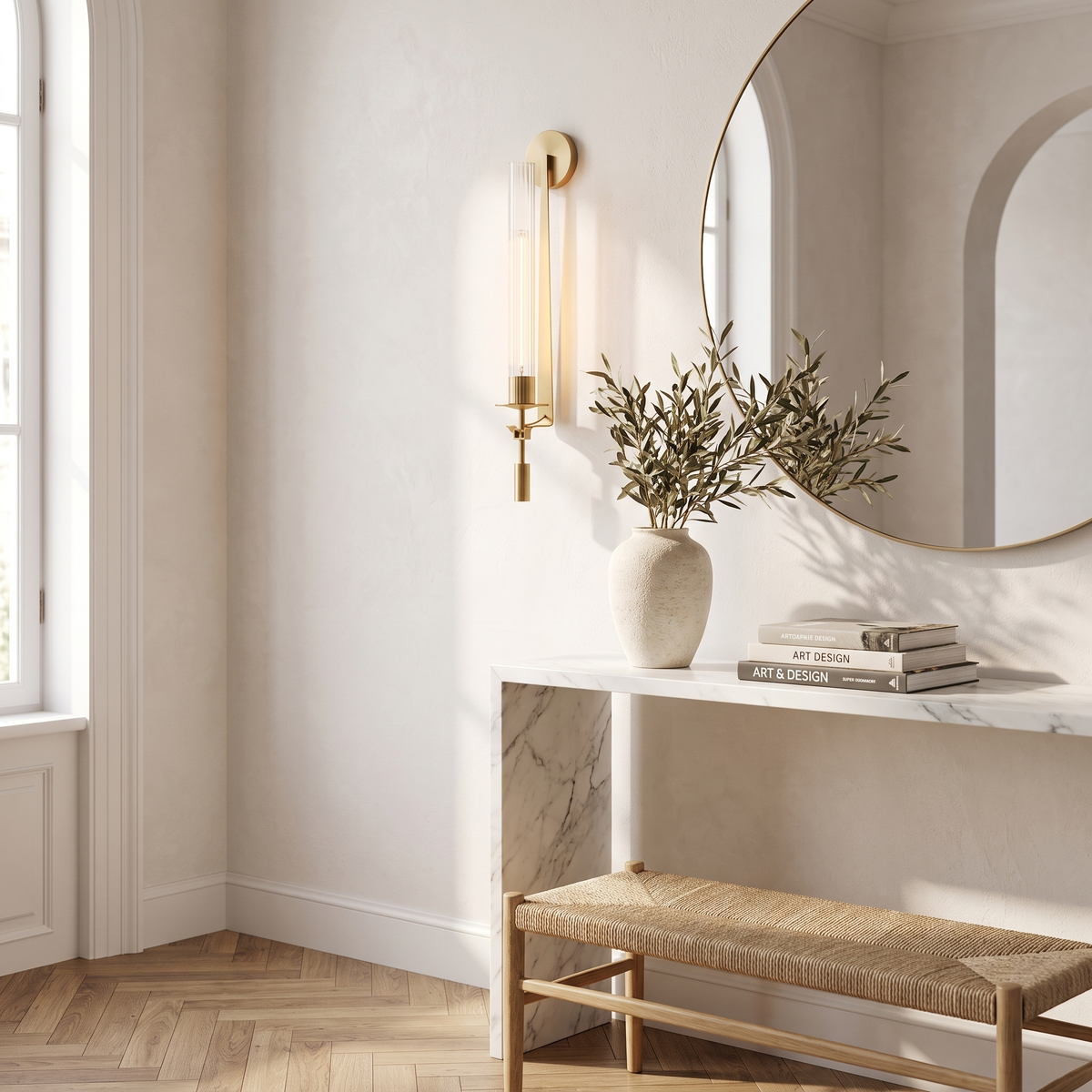 Gold ribbed glass wall sconce above a marble entryway console