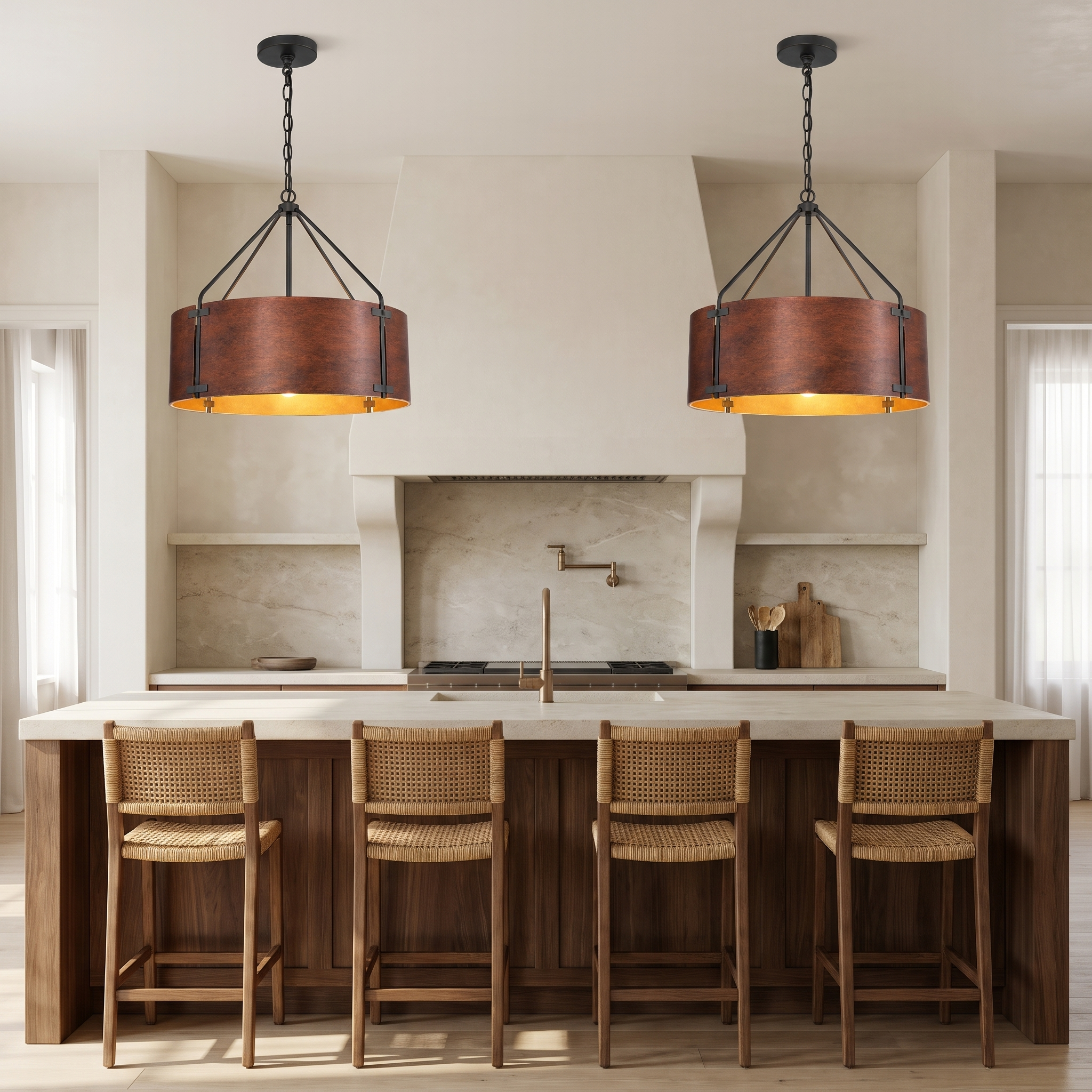 Two small Tamburo bronze drum chandeliers over a walnut kitchen island
