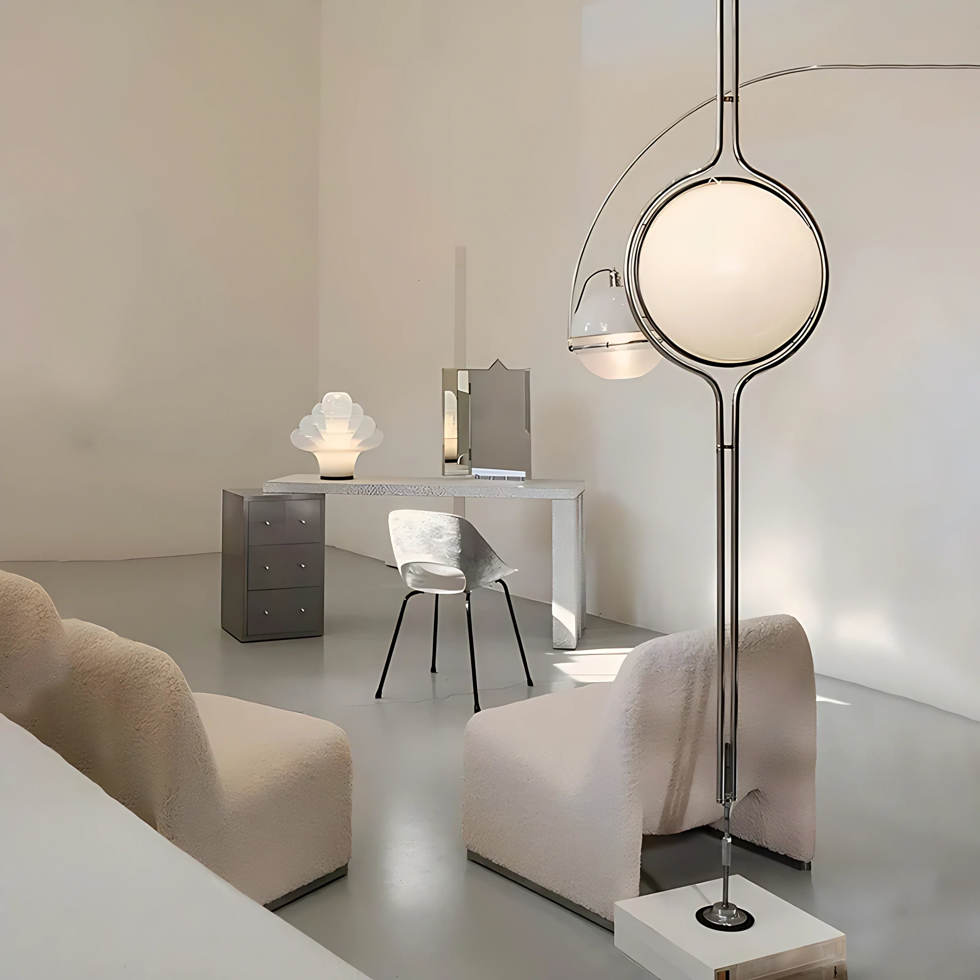 Chrome Sfera Sospesa floor-to-ceiling globe lamp in a bright living room