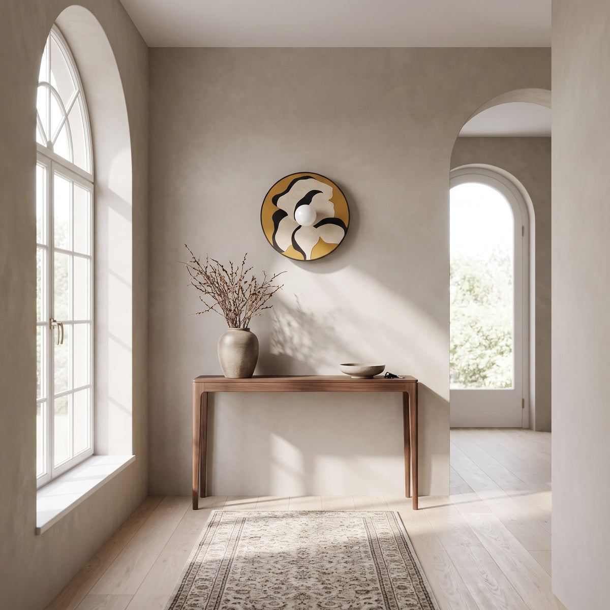 Luna Tessuta wall sconce in Ochre Bloom above a walnut console in a bright entryway