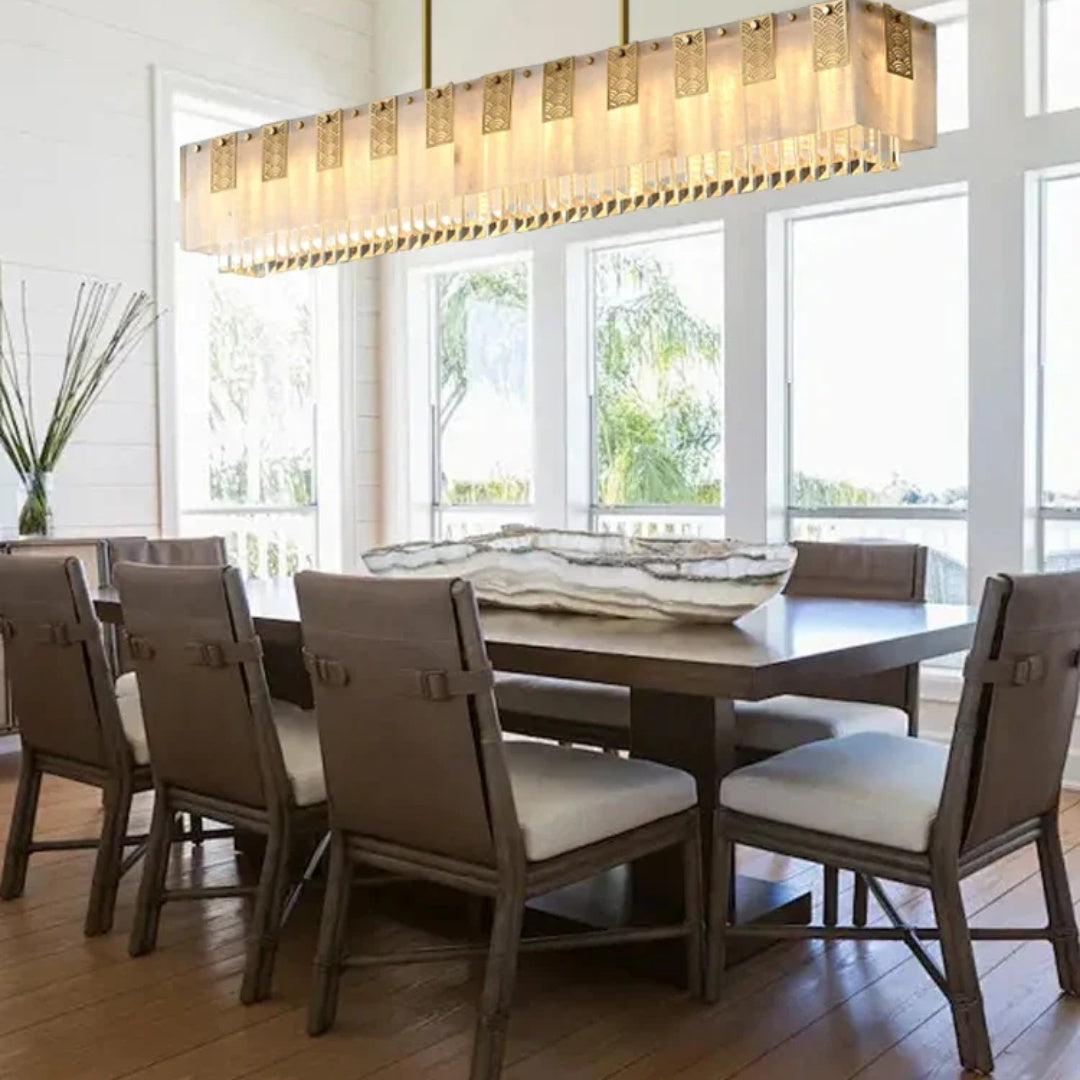 Cascata Brillante gold crystal bar pendant over a dining table