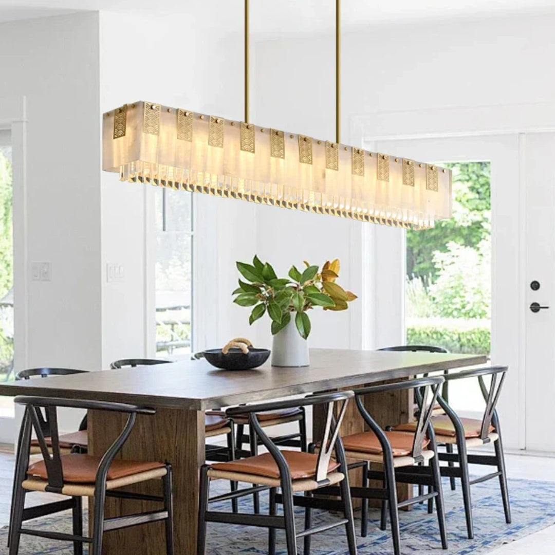 Cascata Brillante gold crystal bar pendant in a bright dining room