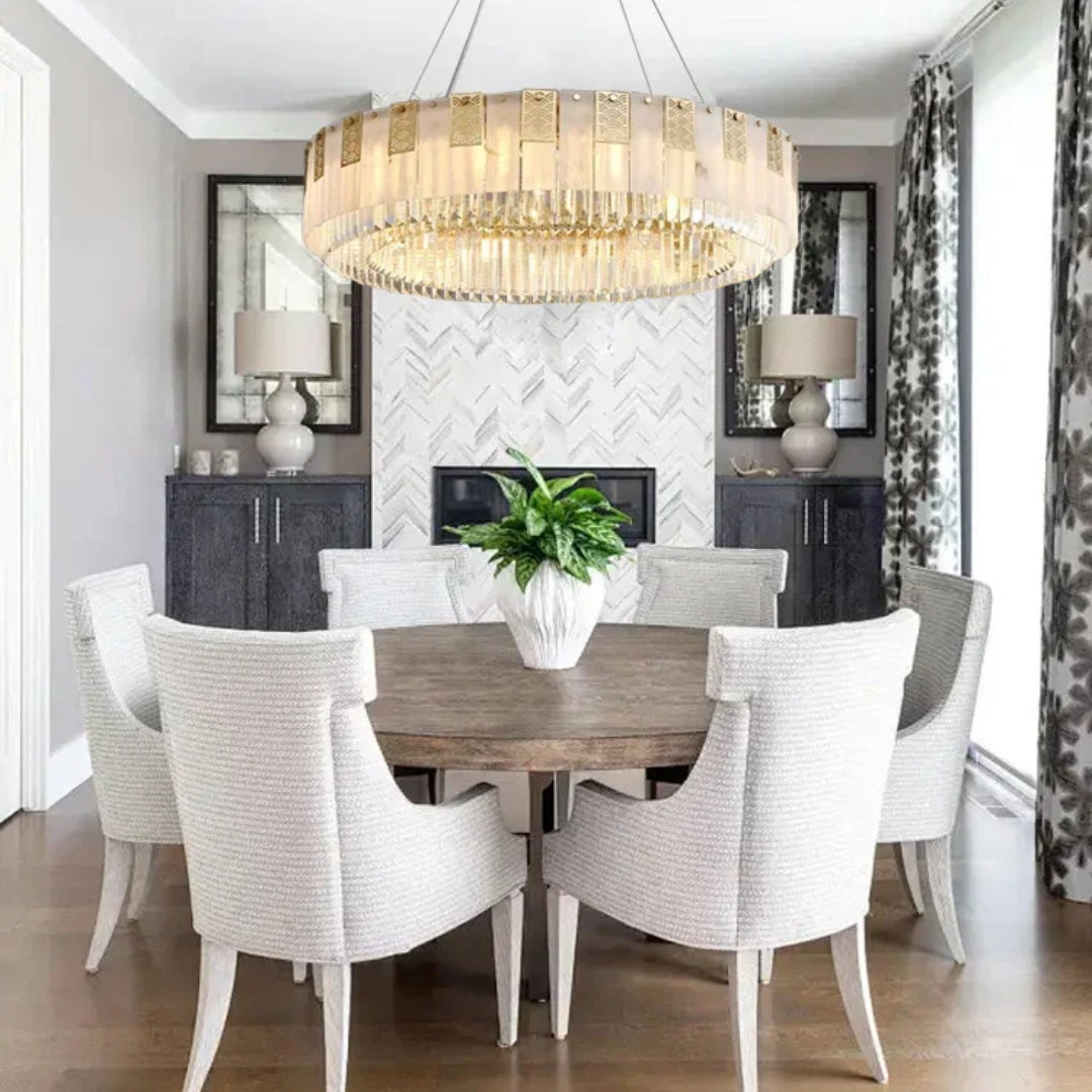 Cascata Brillante round gold crystal pendant over a round dining table