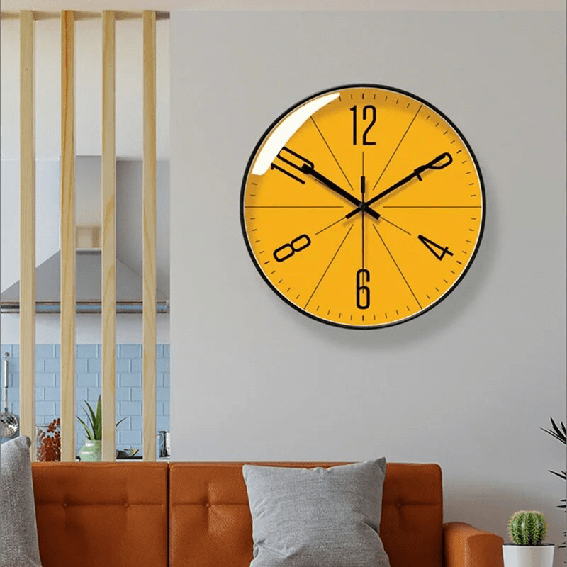 Orange Nordic wall clock above an orange leather sofa