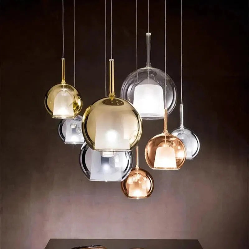 Cluster of Luna Glass Globe Pendants on a warm accent wall