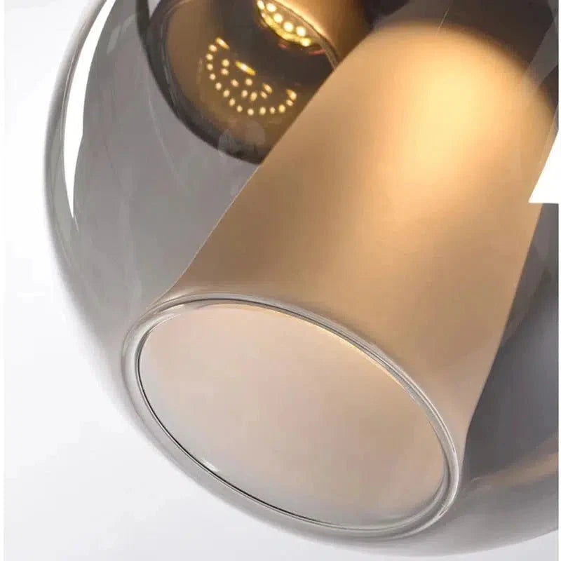 Close-up of the glowing glass globe and frosted inner diffuser