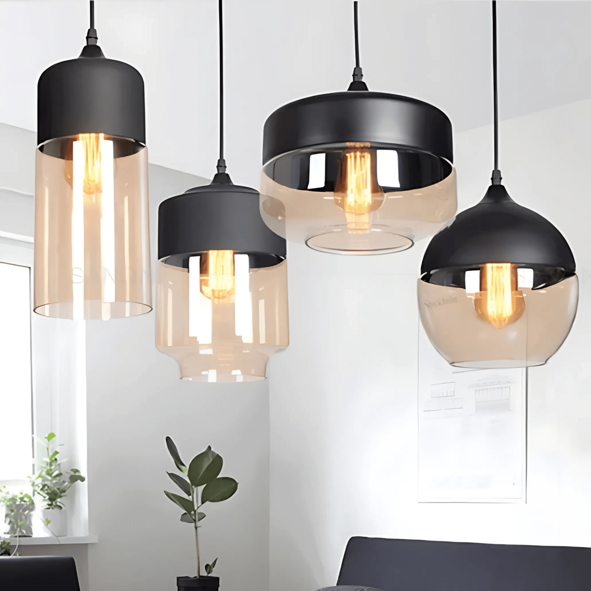 Ambra Art-Glass Pendants in a bright airy room with a plant