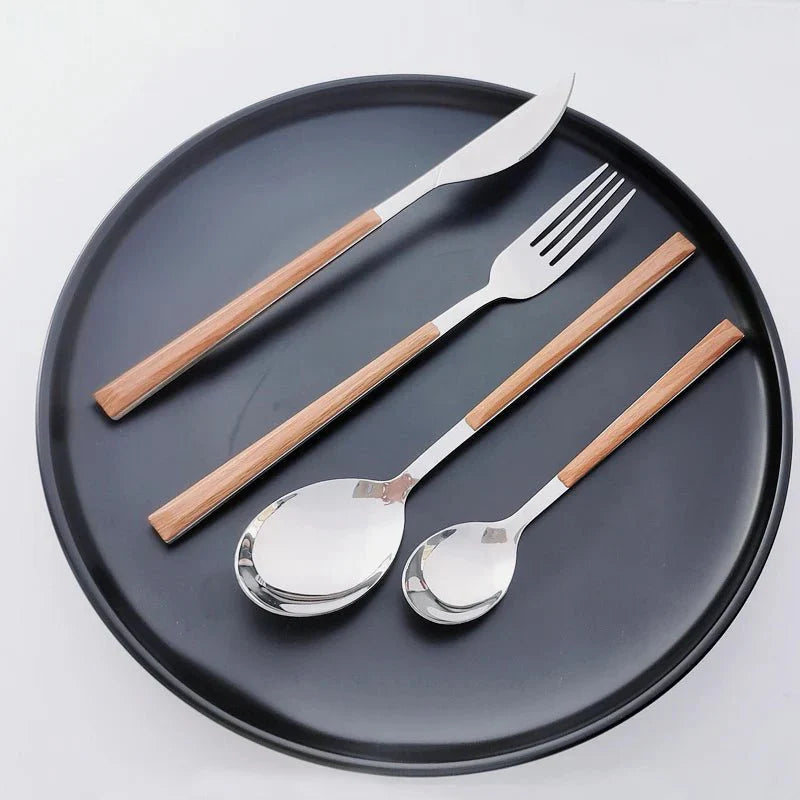 https://cdn.shopify.com/s/files/1/0655/0464/1076/files/stainless-steel-cutlery-set-with-wood-handle-148019.webp?v=1750730673