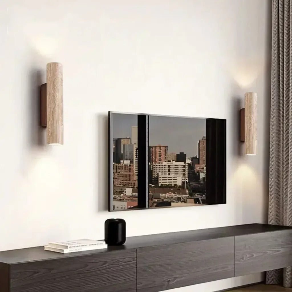 https://cdn.shopify.com/s/files/1/0655/0464/1076/files/stoneshine-wabi-sabi-travertine-wall-lamp-in-the-livingroom.jpg?v=1773354937