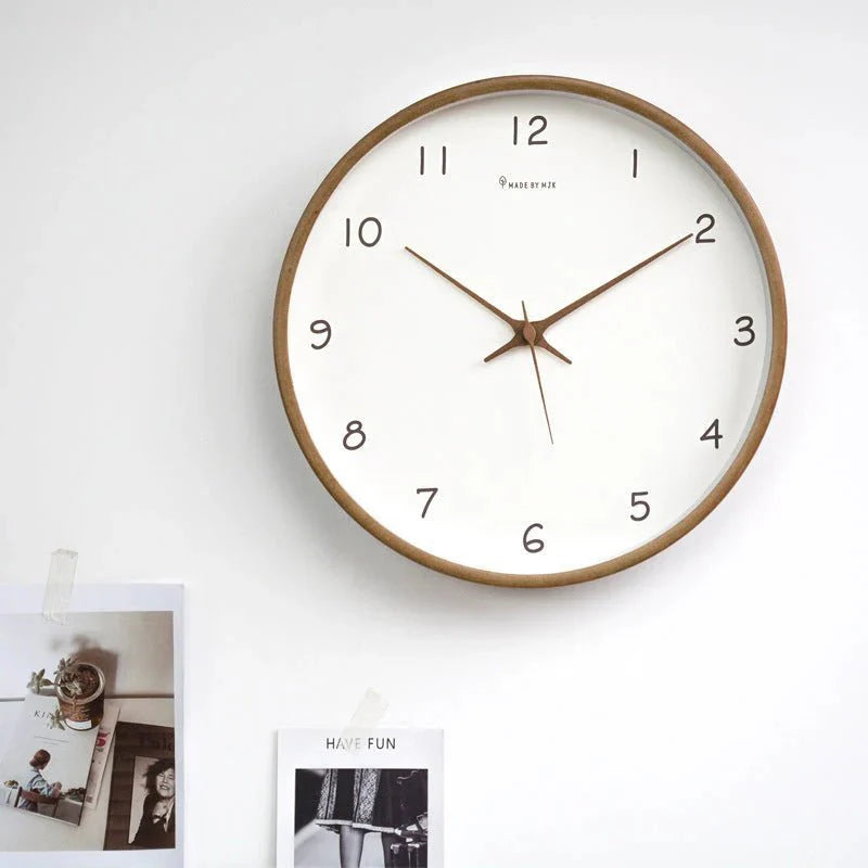 https://cdn.shopify.com/s/files/1/0655/0464/1076/files/timelesswood-solid-wood-analog-wall-clock-with-minimalist-design-551382.webp?v=1773243493
